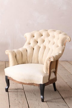 Pair of Napoleon III buttoned fishtail armchairs