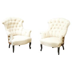 Paire de fauteuils Napoléon III à queue de poisson boutonnée