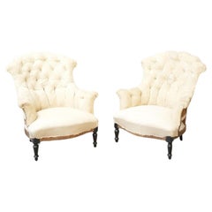 Pair of Napoleon III buttoned fishtail armchairs
