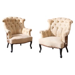 Pair of Napoleon III buttoned fishtail armchairs