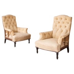 Pair of Napoleon III buttoned shield back armchairs