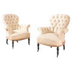 Pair of Napoleon III buttoned spoon back armchairs