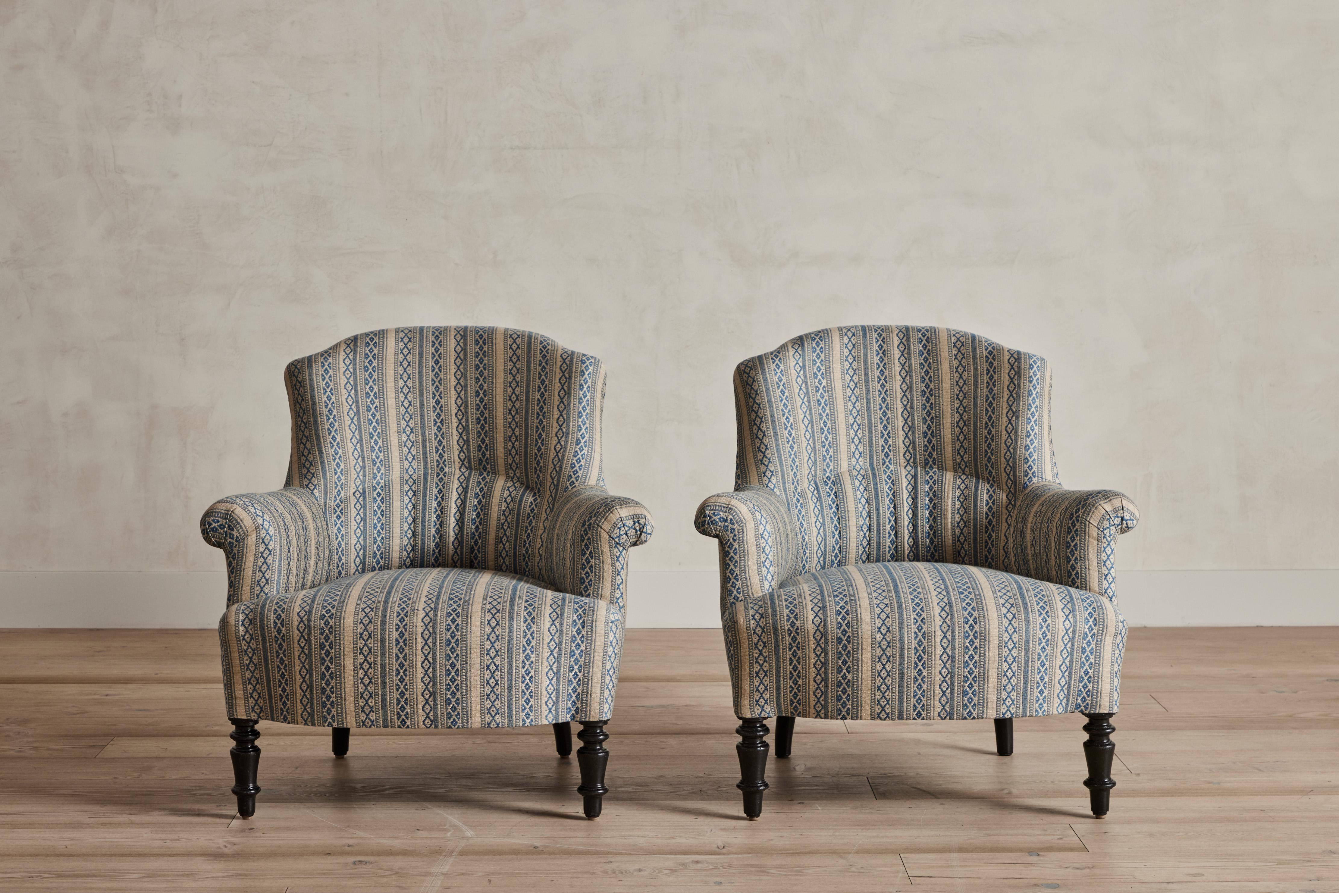 Pair of Napoleon III armchairs from France newly upholstered in Zoe weave in indigo and ivory by Susan Deliss. Wear on wood legs is consistent with age and use. Good vintage condition. New fabric upholstery. Wear on legs and base consistent with age