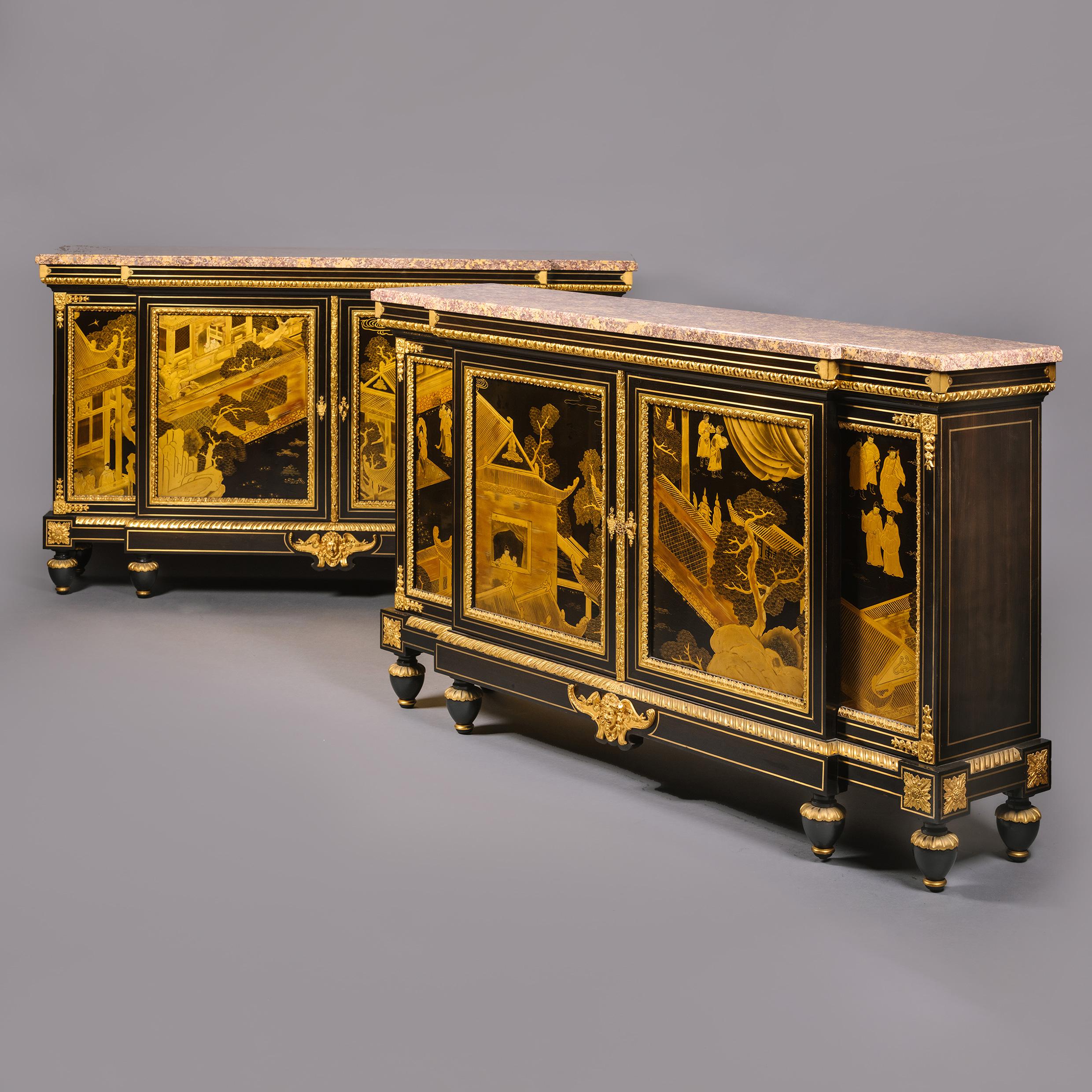 A Pair of Napoléon III Gilt-Bronze, Chinese Lacquer And Ebonised Side Cabinets
By Charles-Guillaume Winckelsen, Paris.

Signed 'Chles WINCKELSEN 21 Rue St Louis', Paris. 

Each with a top of the finest brocatelle jaune d’Espagne marble above a