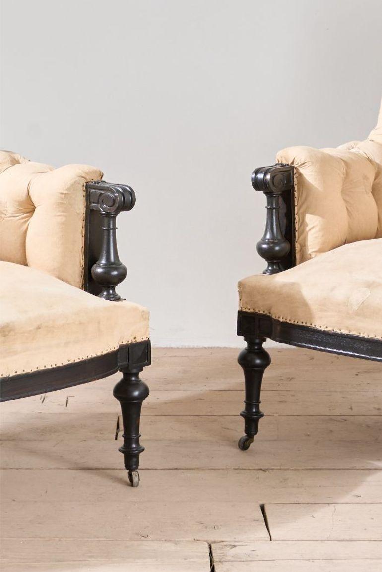 These are a very high quality pair of large shield back Napoleon III armchairs. Deep buttoned and attractive carved ebonised show wood frame. Generous proportions and very comfy

Measurements Height 101cm Width 77cm Depth 82cm Depth of seat 54cm