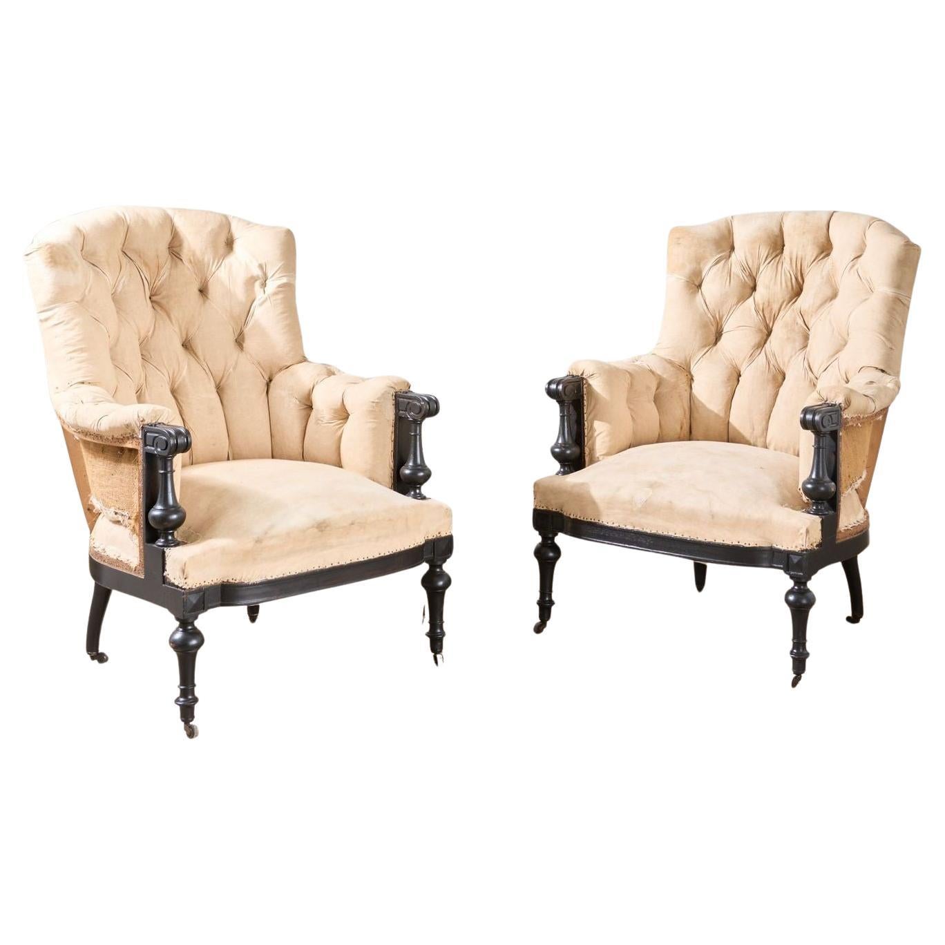 Pair of Napoleon III large buttoned shield back armchairs