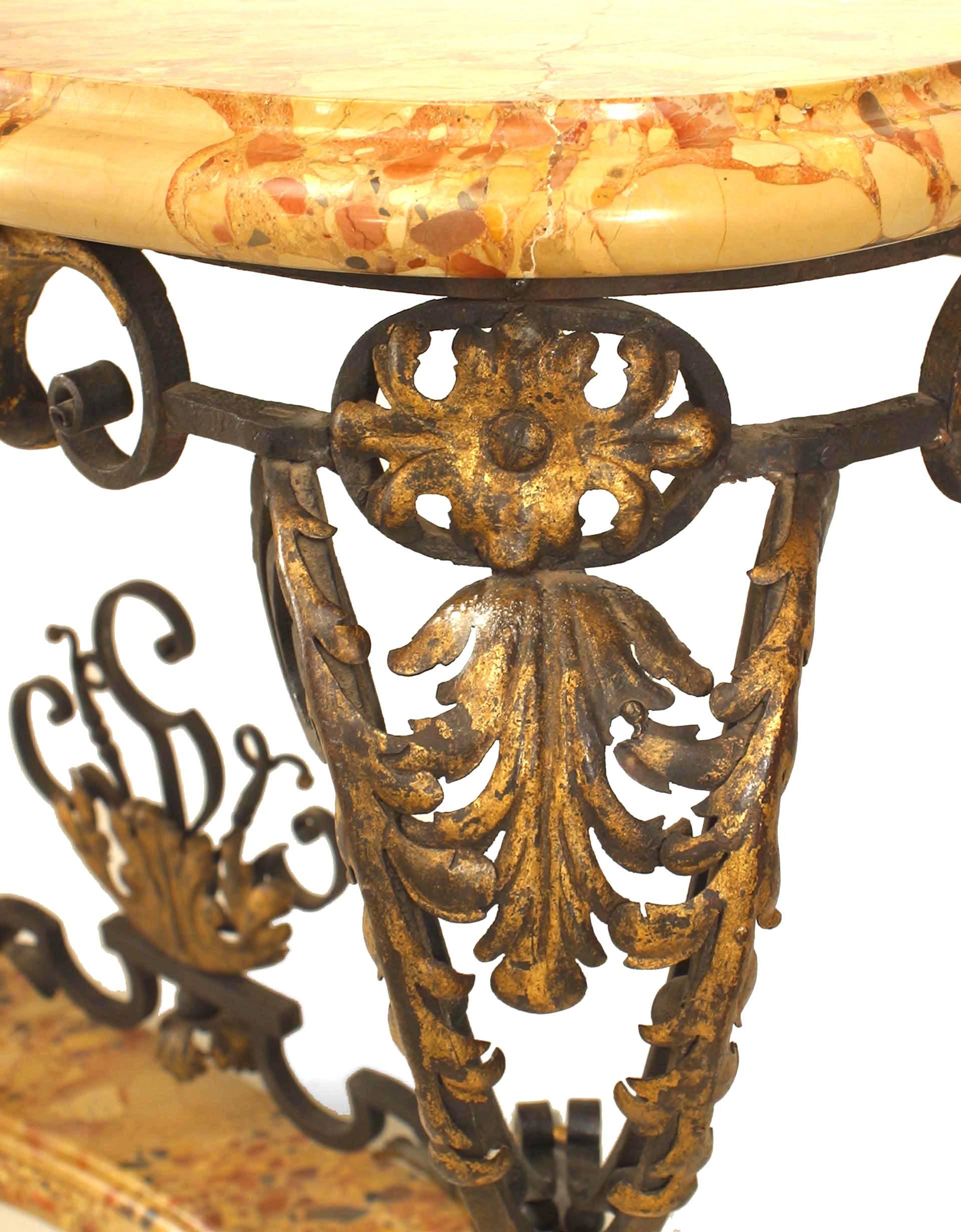 Pair of French Victorian (Napoleon III, 19th Century) iron console table with scroll form design and applied gold painted floral trim with a stretcher and a Breche d'Alep marble base & top. (PRICED AS Pair)
