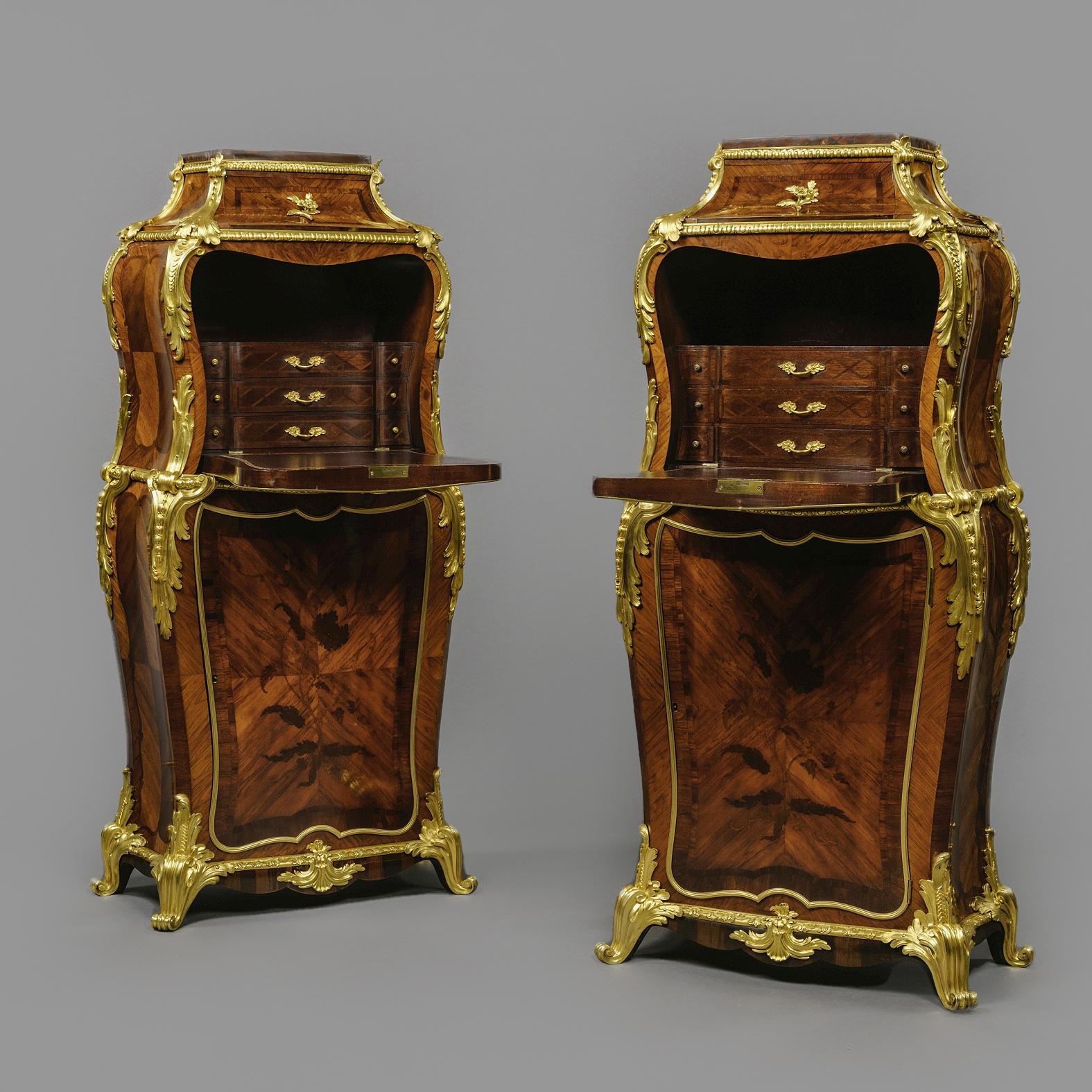 A pair of Napoleon III gilt-bronze mounted, Marquetry Inlaid Secrétaires Abbatants, by Henry Dasson, After the Model by Jean-Francois Dubut. 

Stamped to the reverse of the bronze mounts 'HD' for Henry Dasson. 

This remarkable pair of Louis XV