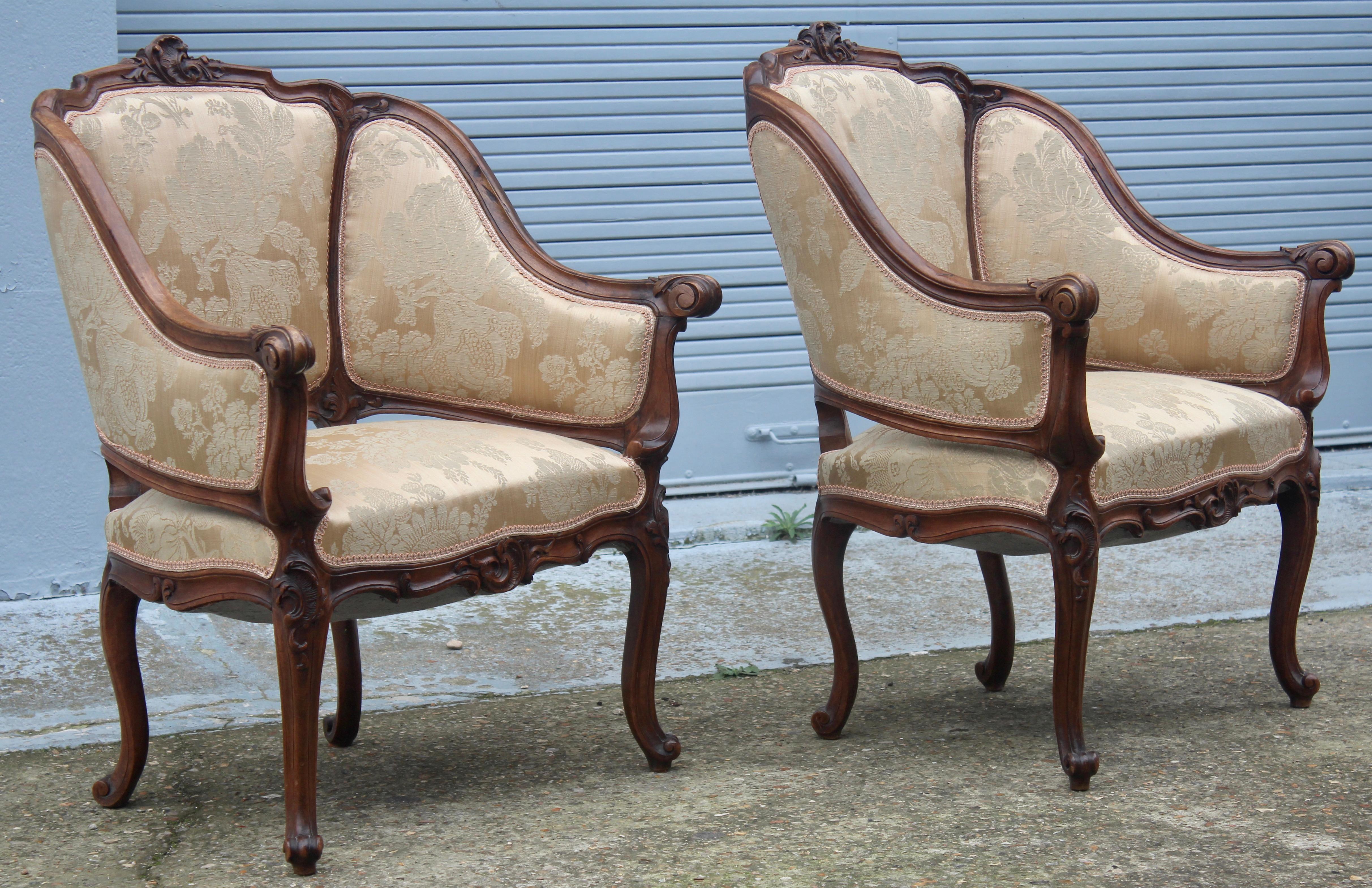A pair of Napoléon III Period molded and carved walnut marquises
Rich ornementation of shells, foliages and scrolls
Louis XV style,
circa 1890
Silk upholstery.
 