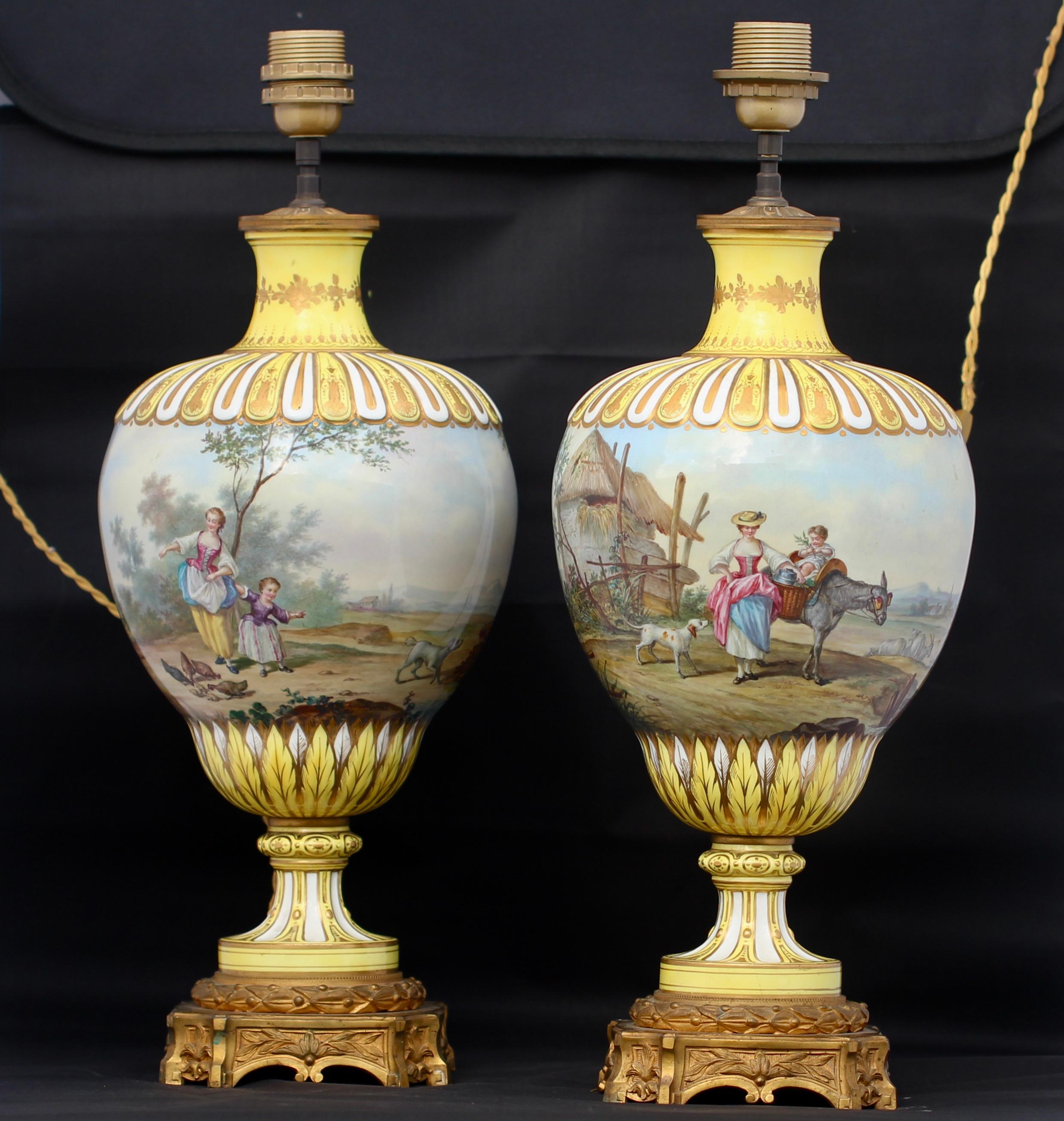 Pair of Napoléon III polychromed Paris Porcelain baluster vases ormolu-mounted in lamps
pastoral scenes hand painted all around on a yellow and gold ground
Louis XVI style,
circa 1880
Electrified.
 