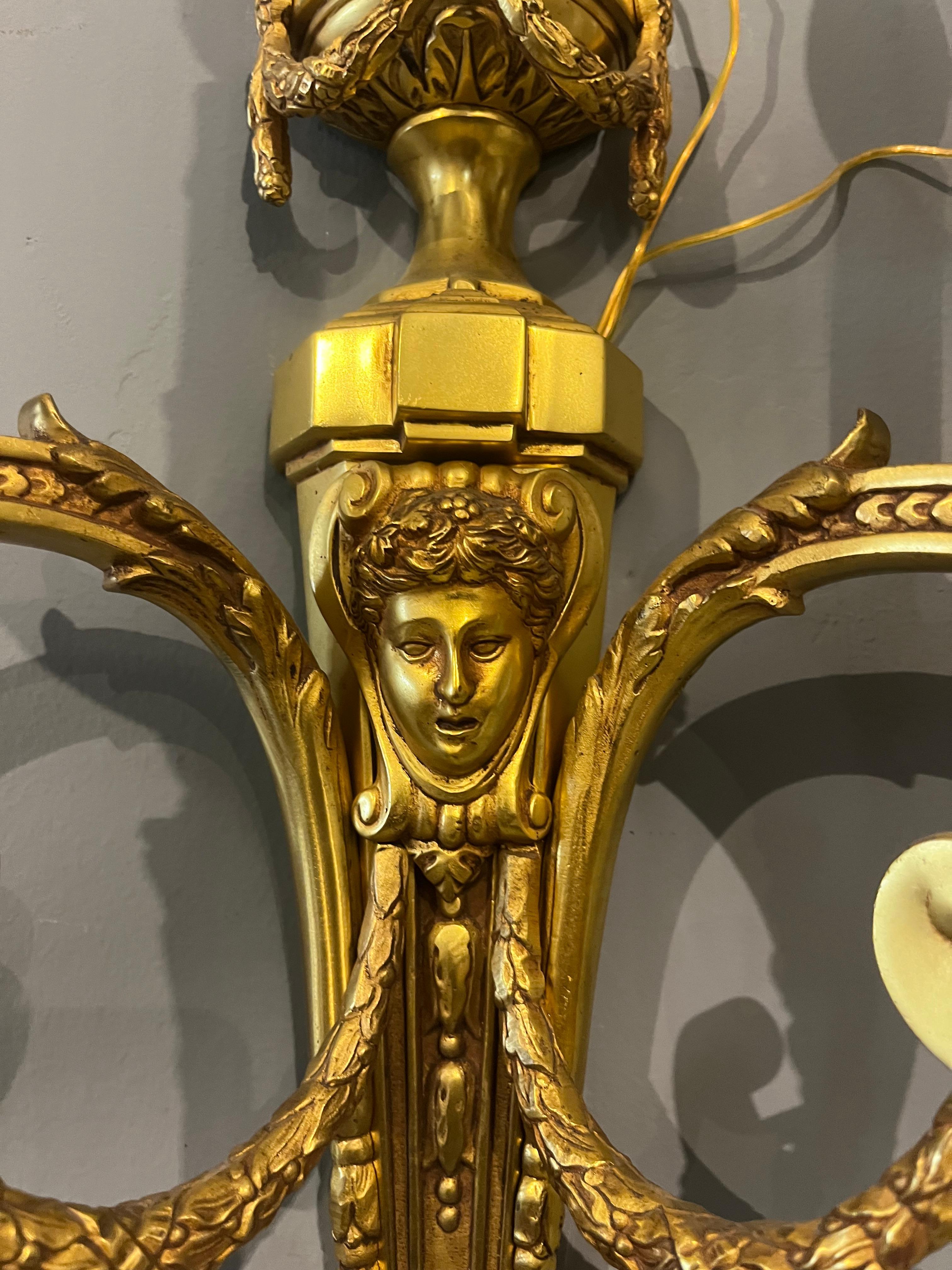 Mid-20th Century Pair of Napoleon III sconces in chiseled gilded bronze, 19th century in vendita