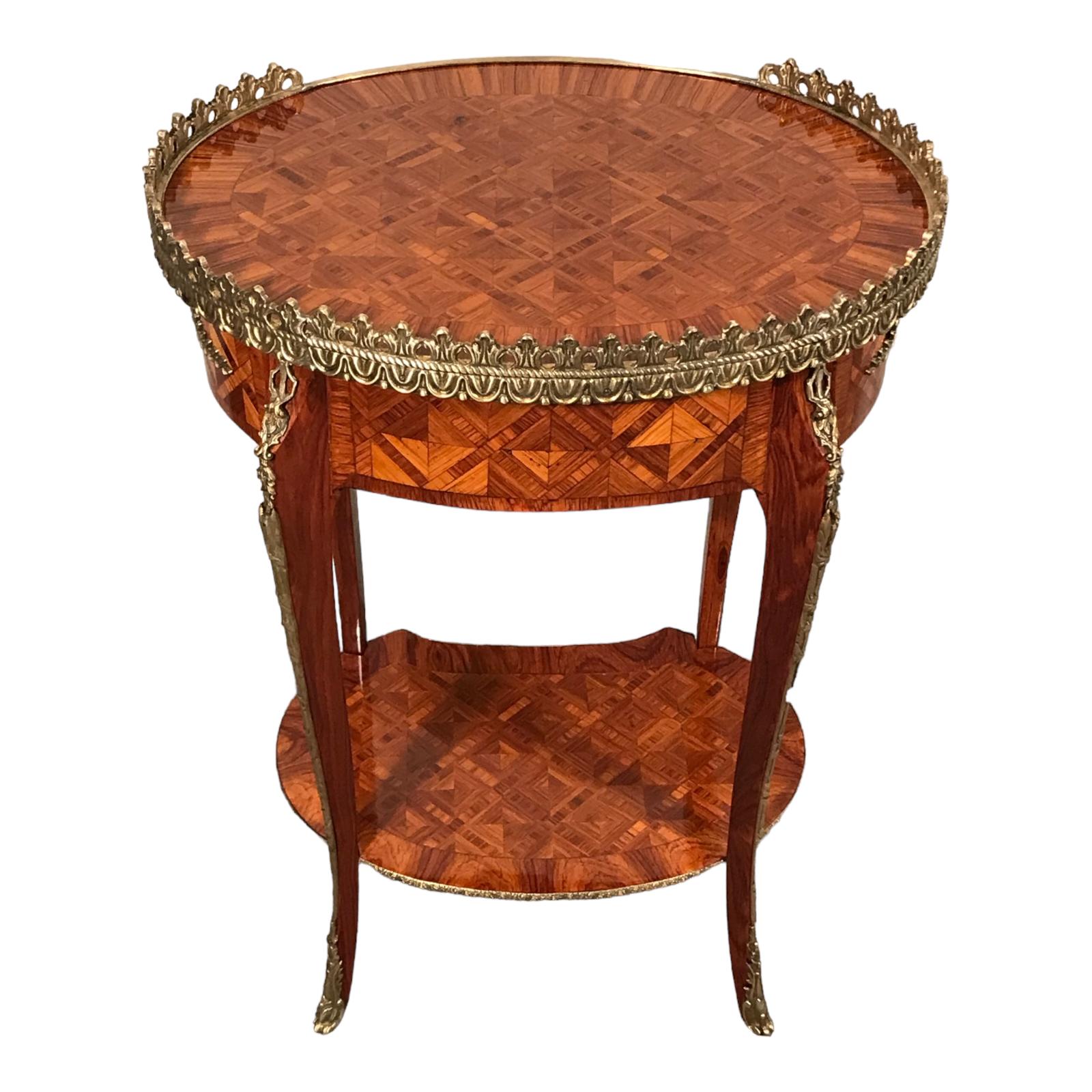 Discover our stunning pair of Napoleon III Side Tables, featuring elegant oval shapes standing on slender, slightly curved legs adorned with intricate floral brass fittings. Each table boasts a convenient drawer in the upper part, complemented by a