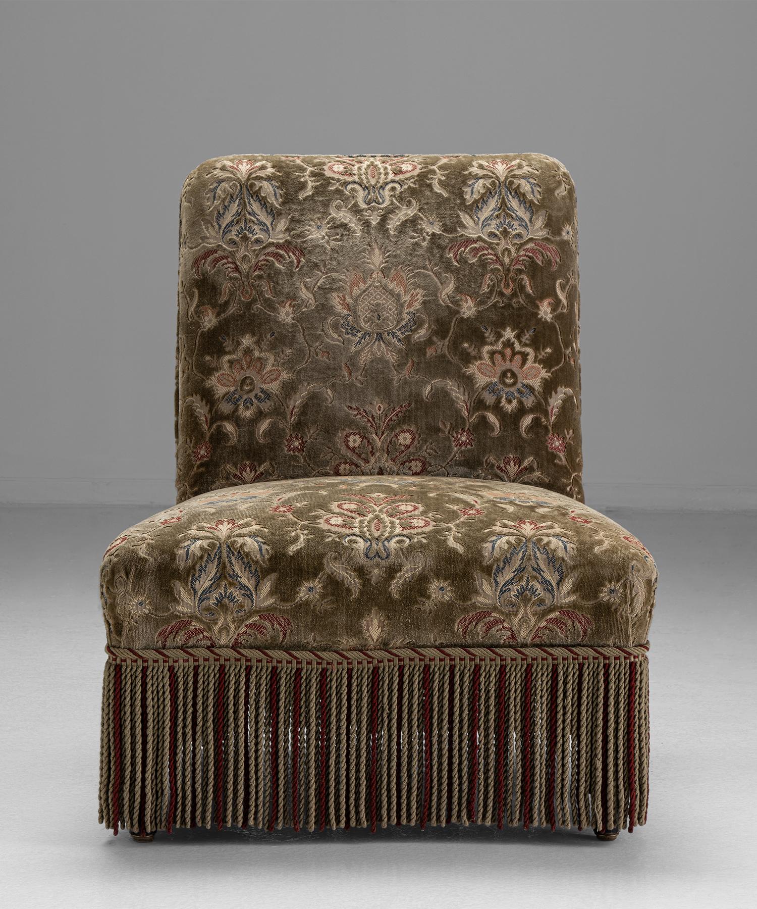 Pair of Napoleon III slipper chairs 

France Circa 1860

Original velvet upholstery and fringe, on ebonised legs.

Measures: 24.5”W x 27.5”D x 31”H x 14.75” seat.