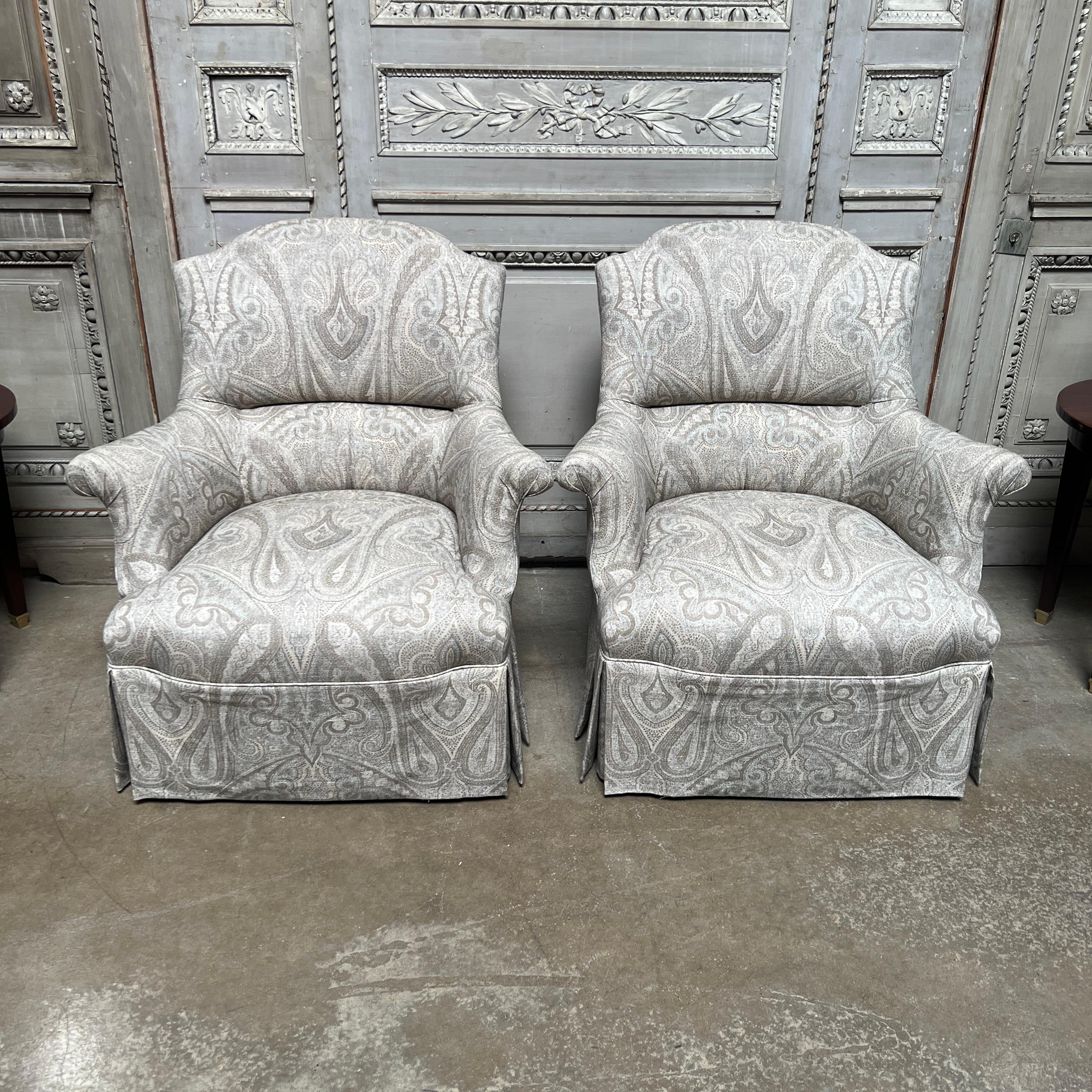 A pair of 21st century Napoleon III style armchairs in the style of Madeleine Castaing. This pair of comfortable and very stylish chairs are a few years old and were copied after an antique pair that we had in stock.