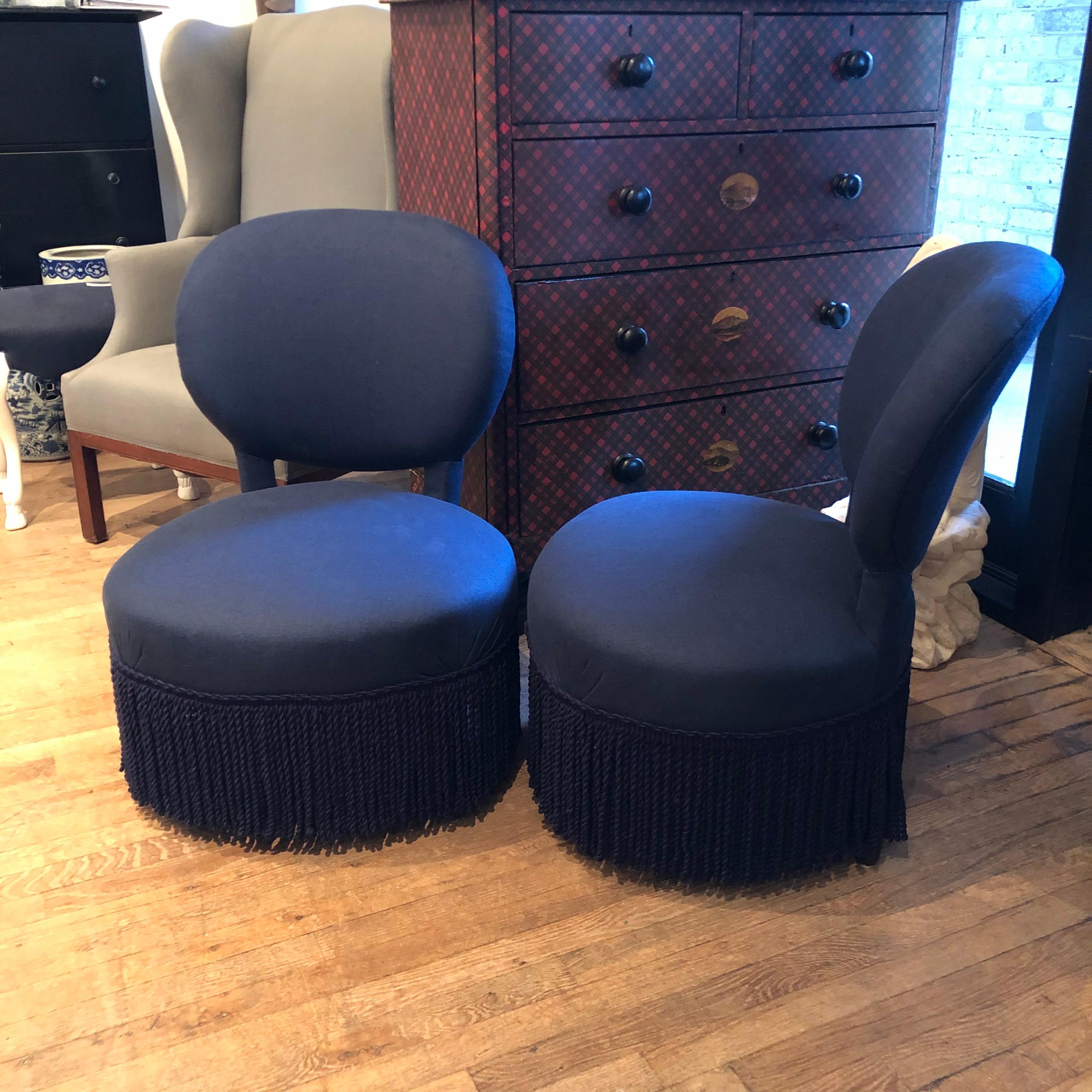 Pair of Louis style, Napoleonic slipper chairs newly upholstered midnight blue linen with coordinated bullion fringe.
       