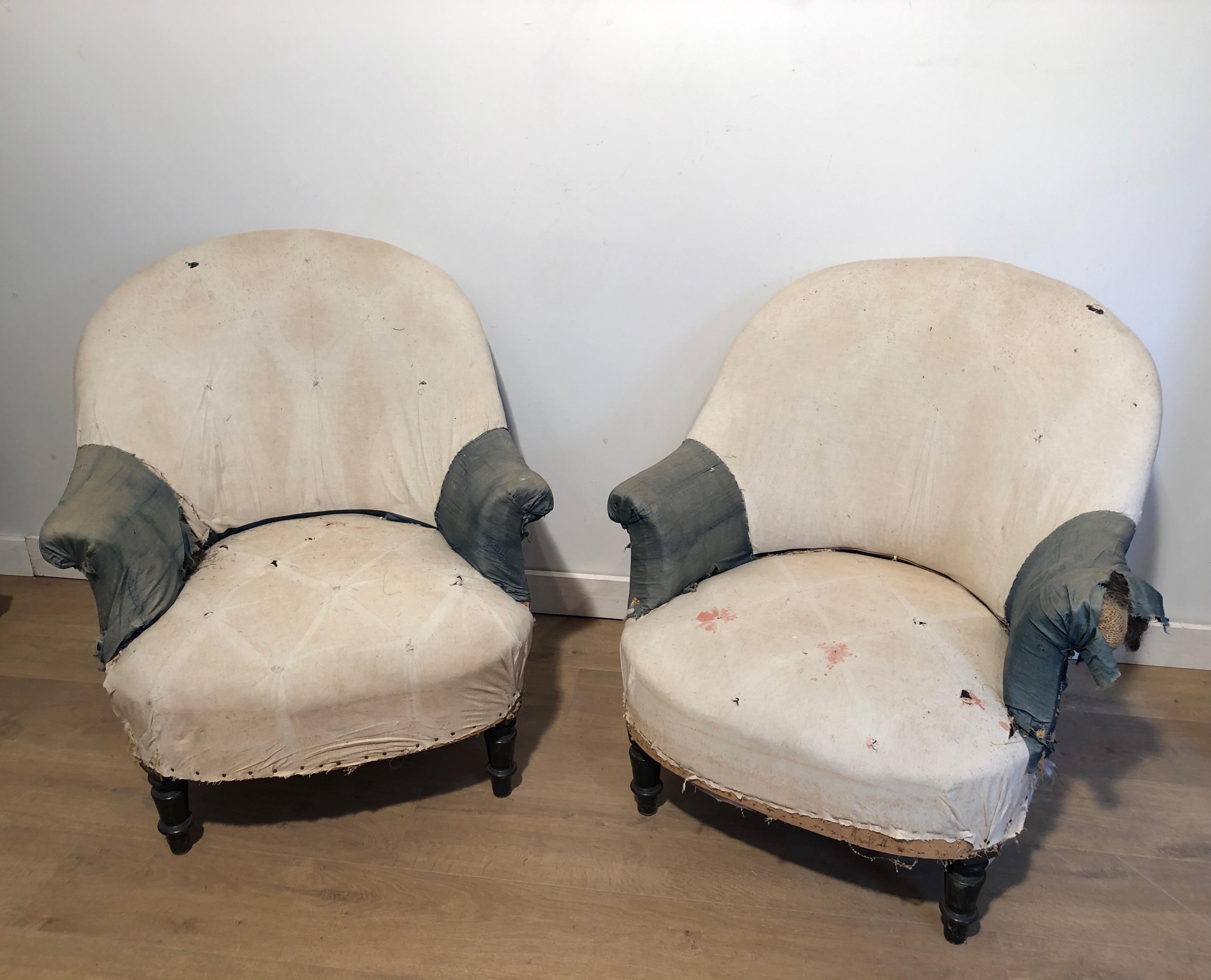 This pair of Napoleon the 3d armchairs is made of wood and fabric. The armchairs need to be rehupholstered. This is a French work, circa 1900