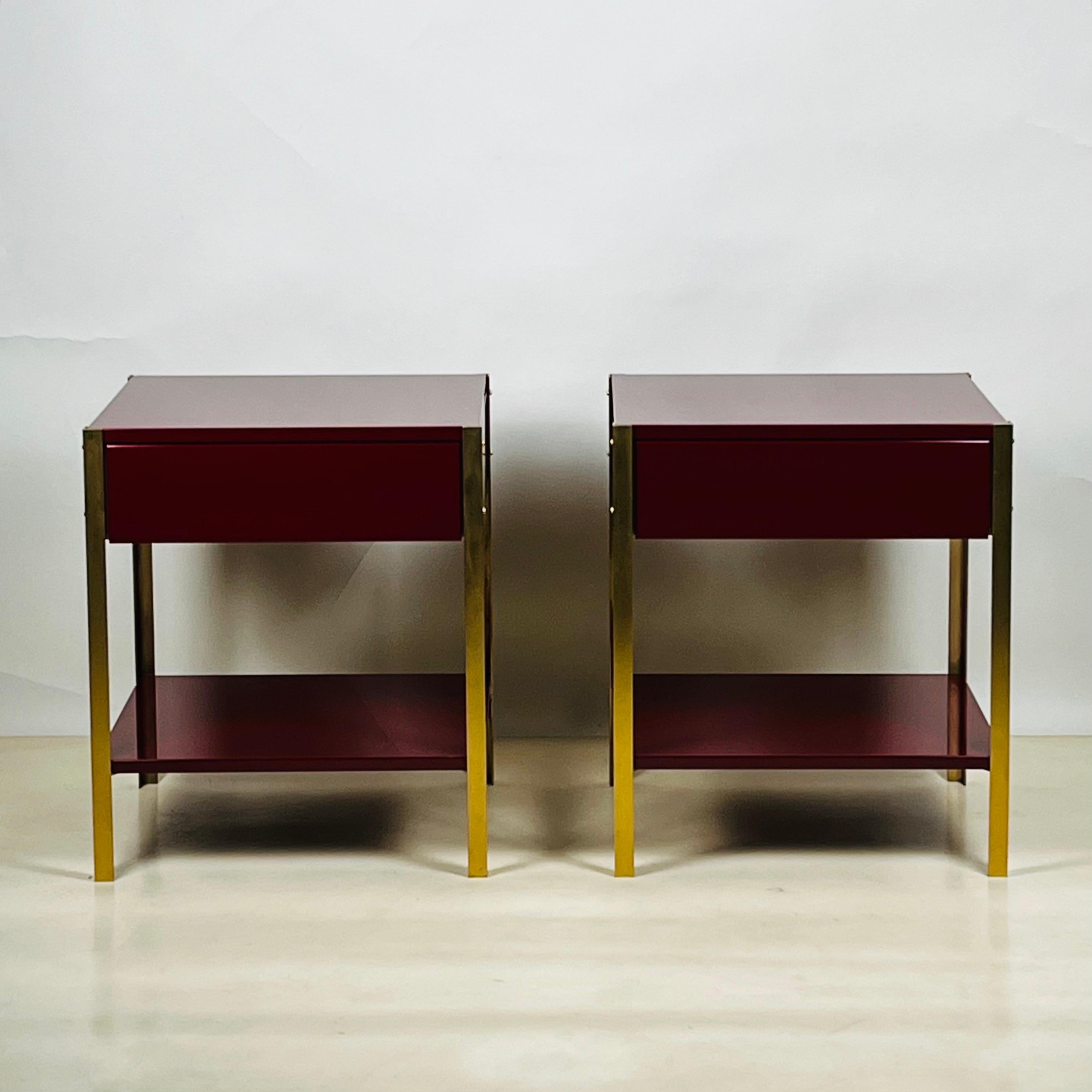 Pair of narrow 'Laque' oxblood lacquer and brass night stands by Design Frères.
Soft close drawer slides.
Chic and understated.
