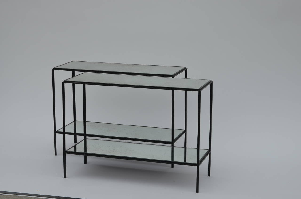 Pair of chic 'Rectiligne'™ mirrored wrought iron two-tier end / side tables by DESIGN FRÈRES®. Lower shelf is at 6 in. from floor.


