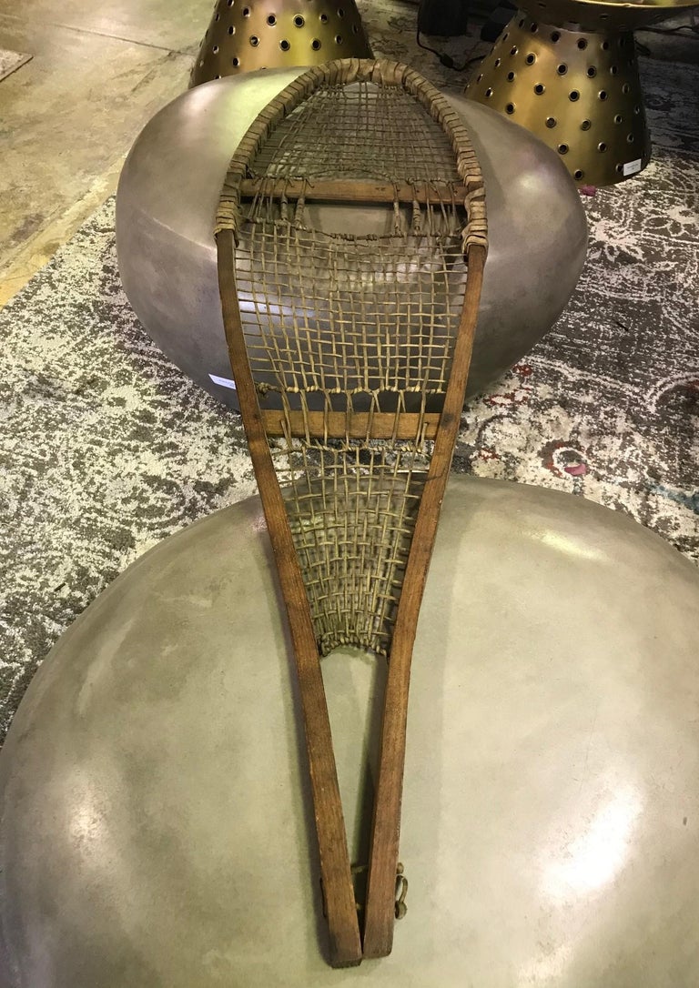 Pair of Native American Rawhide Pom Pom Snowshoes, Late 19thEarly 20th