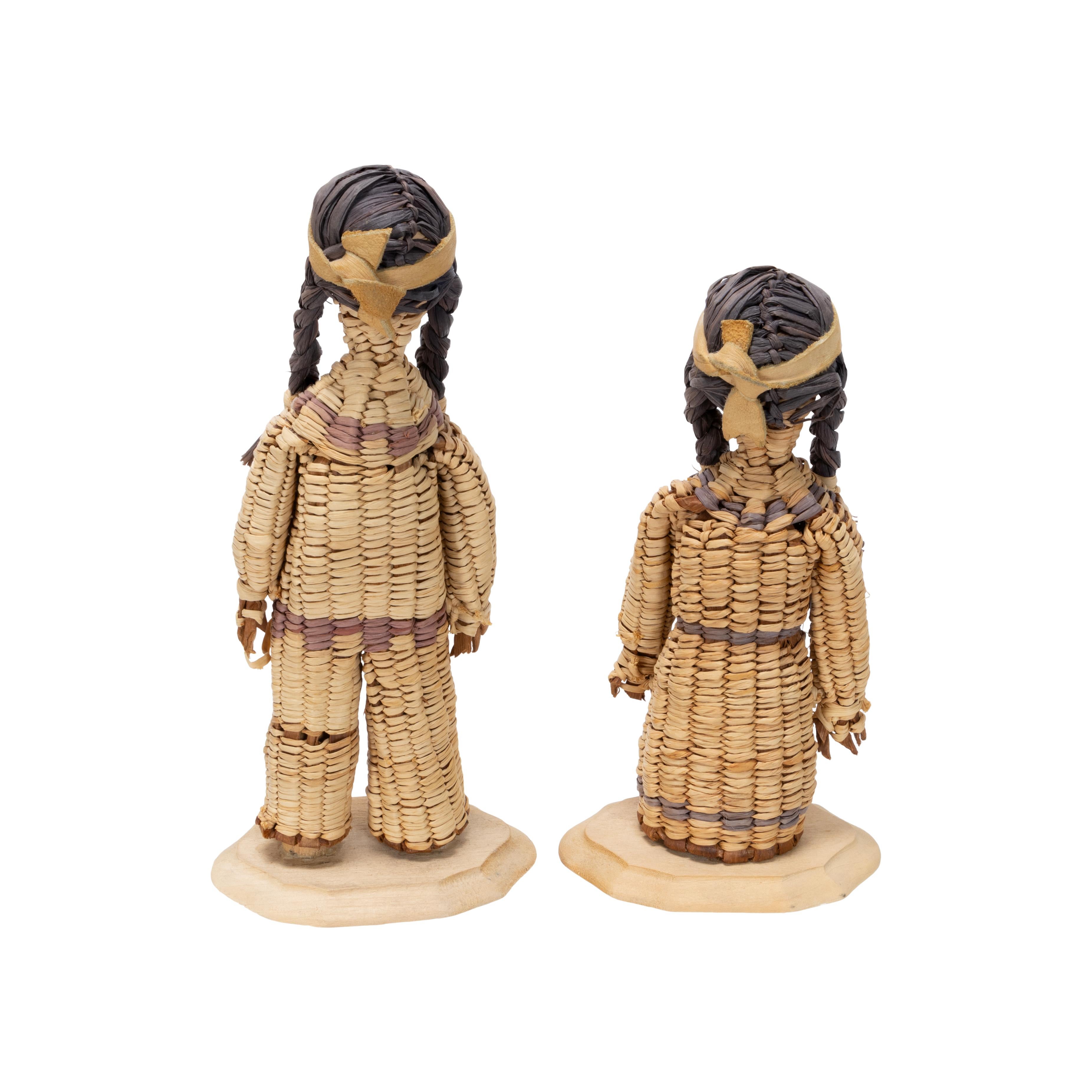 Pair of Native American Yakama dolls. Basketry style, reminiscent of corn husk dolls. Male and female dolls both signed 