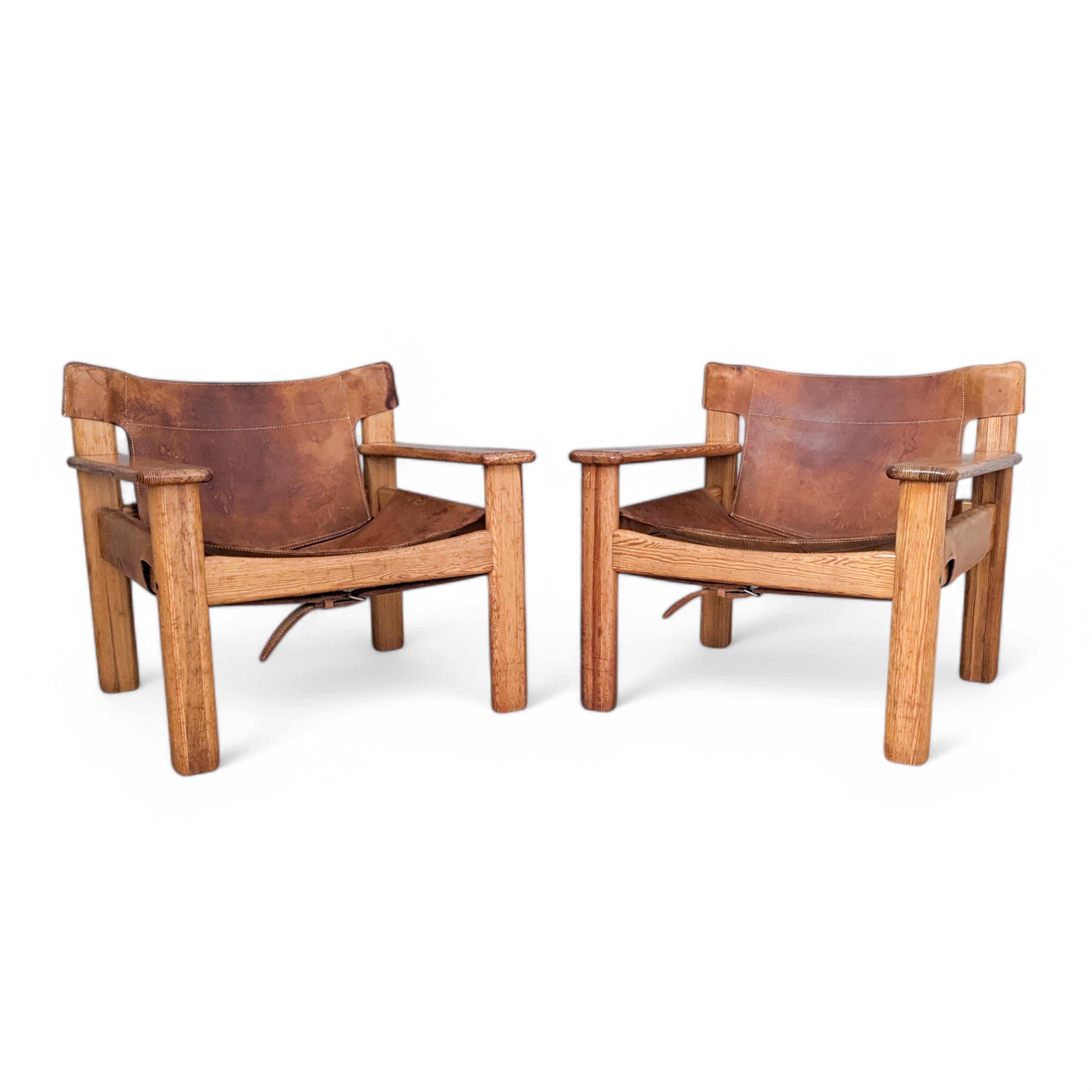 Pair of Natura armchairs designed by Karin Mobring for IKEA in 1976. Crafted with a blend of natural materials and Scandinavian minimalism, these chairs feature a striking yet understated aesthetic.

This pair showcases thick, patinated cognac
