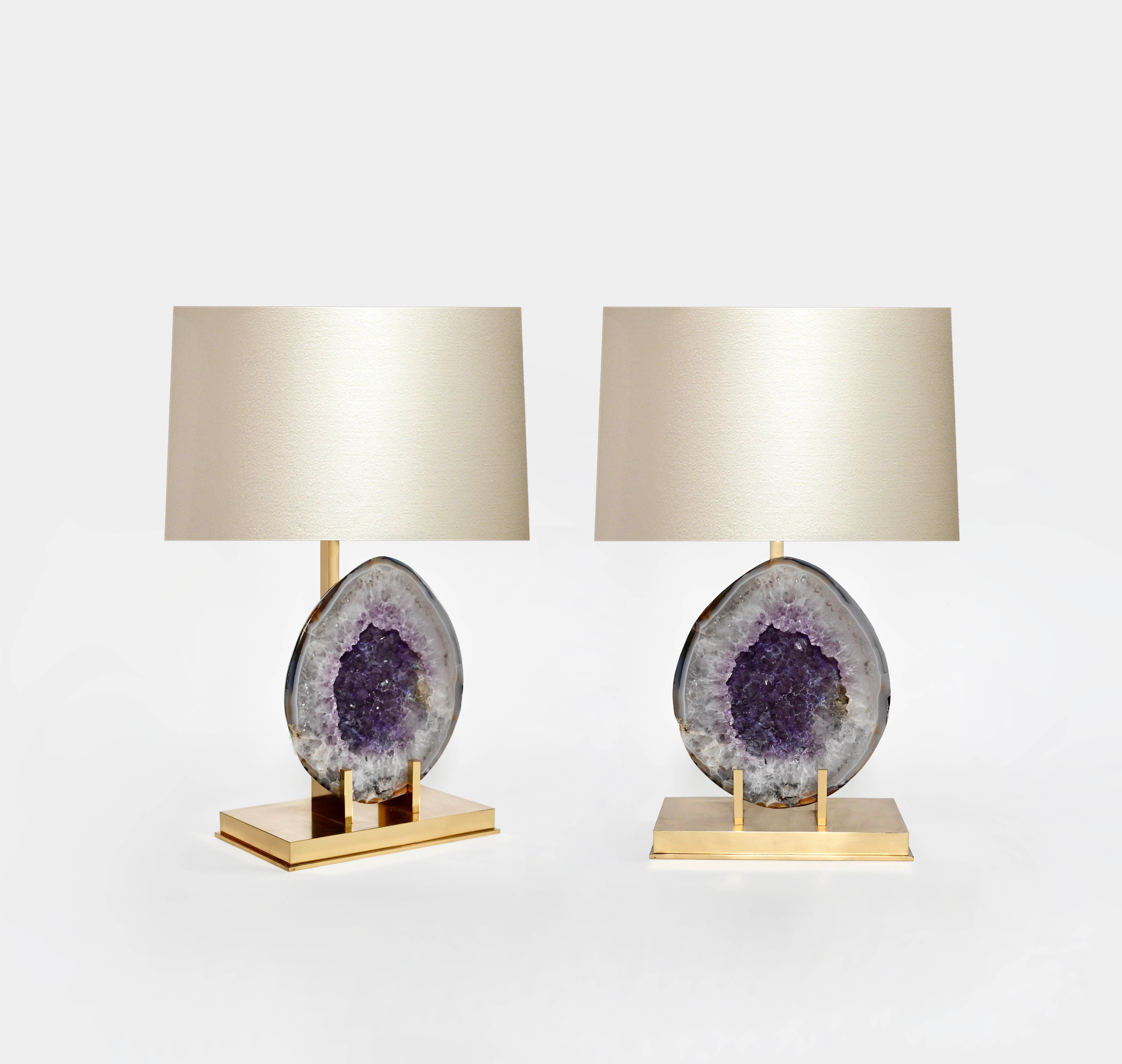 Pair of natural amethyst lamps with polished brass bases.
(Lampshade not included.)
