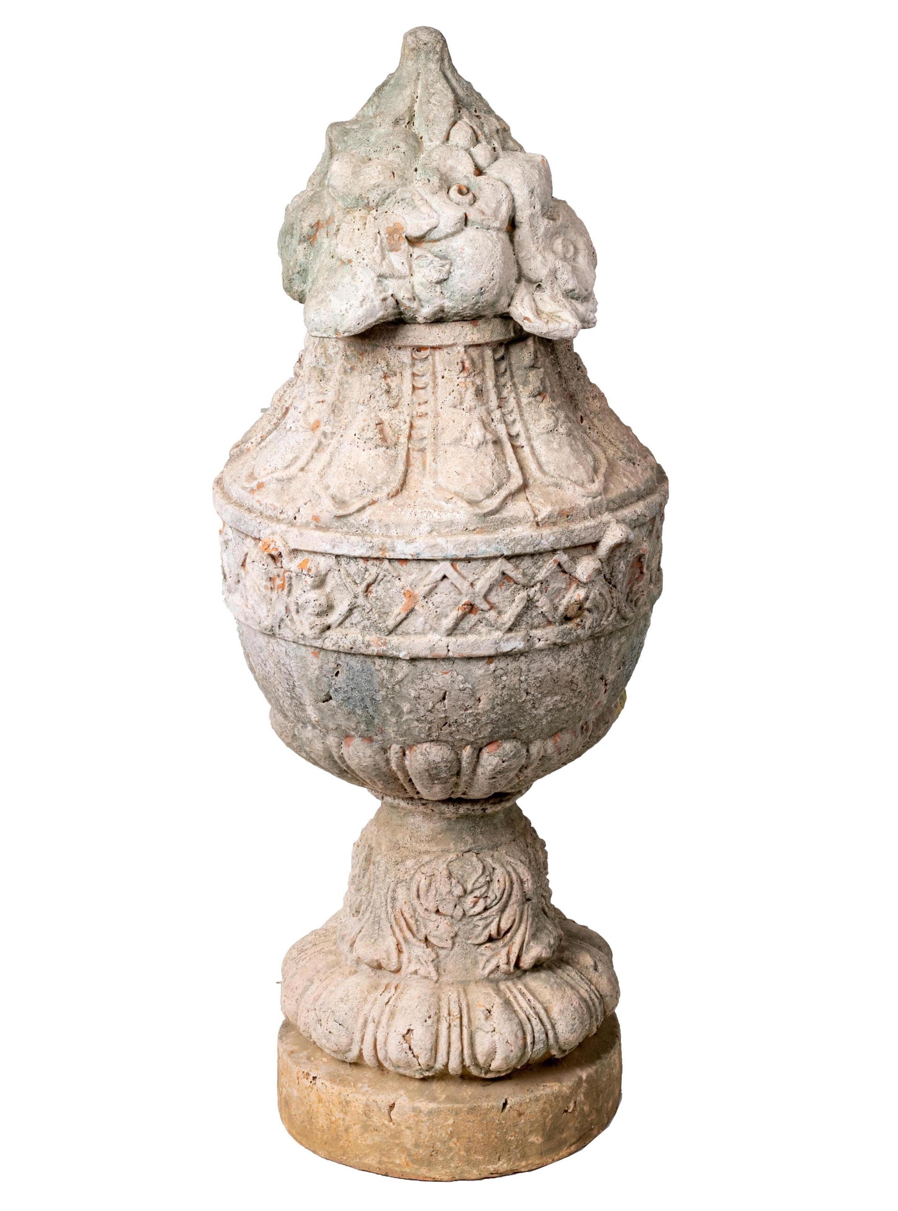 Pair of natural French terracotta urns with lids.
      