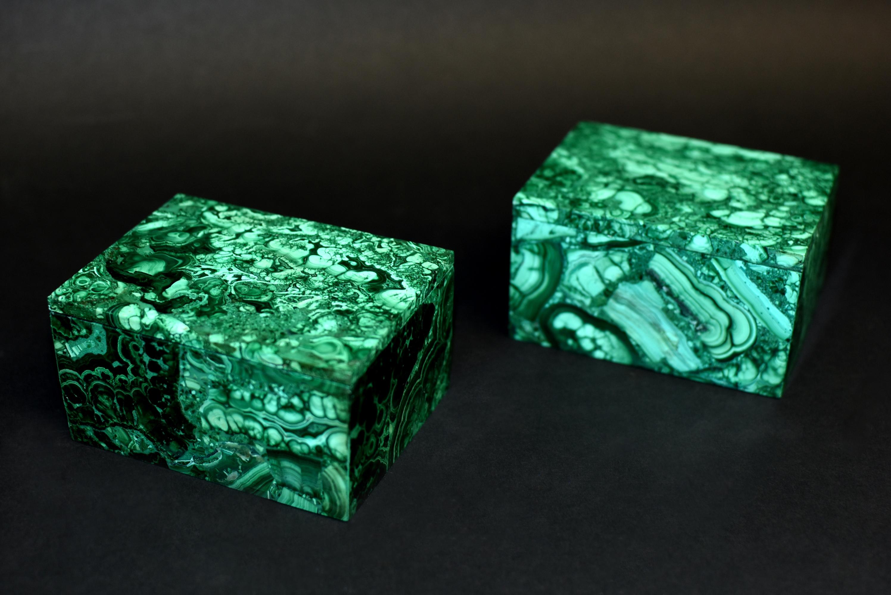 A pair of full slab, spectacular all natural malachite boxes with splendid swirls and patterns. These remarkable pieces add a luxurious and sophisticated touch to your home. Malachite is a stone of transformation, helping one achieve balance and