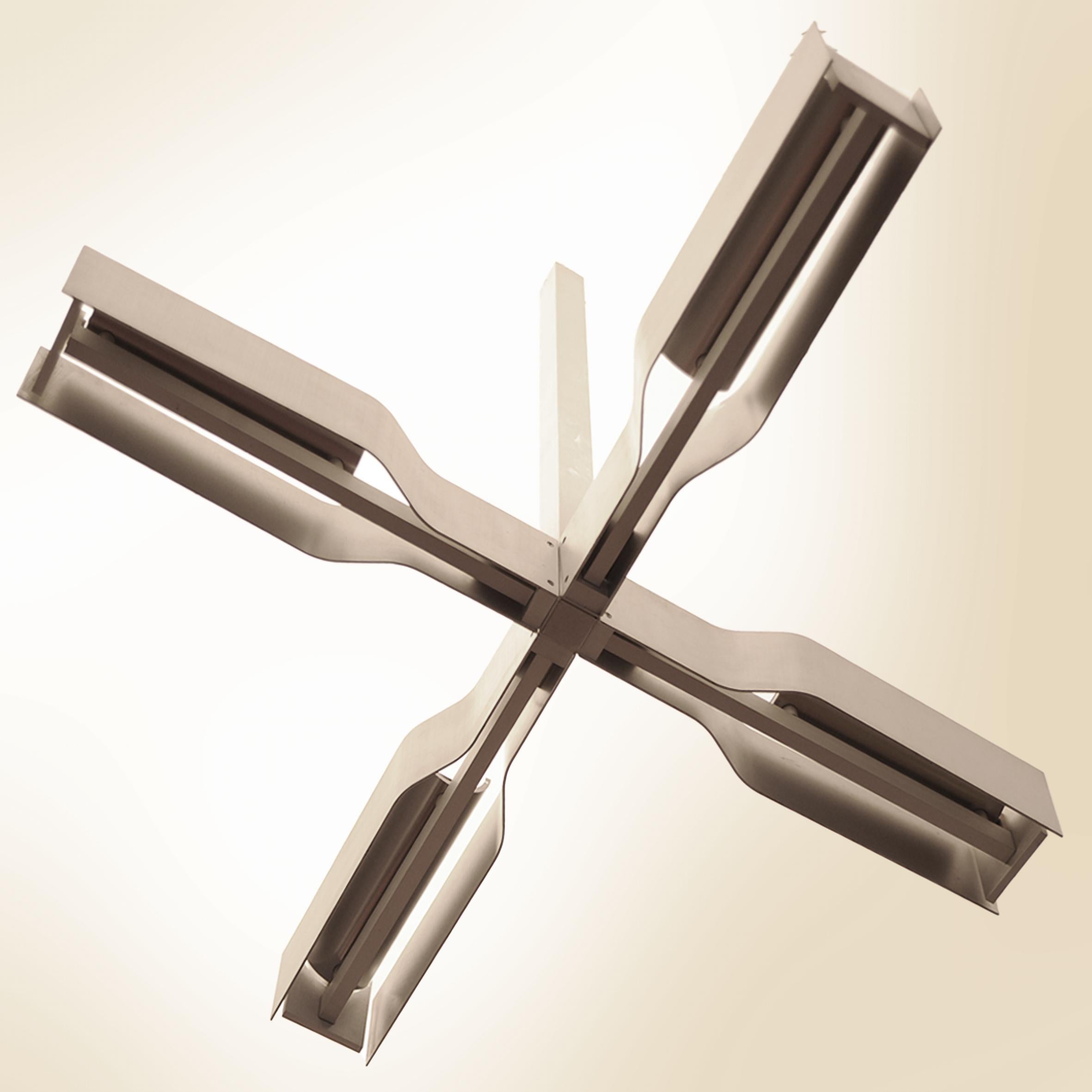 Natural tone anodized aluminum chandelier, 1970.
Rare creation by César Putzeys ( 1929-1999 ) for Verre Lumière.

Verre Lumière is a French company founded in 1968 by master glassmaker and decorator Max Ingrand (former artistic director of Fontana