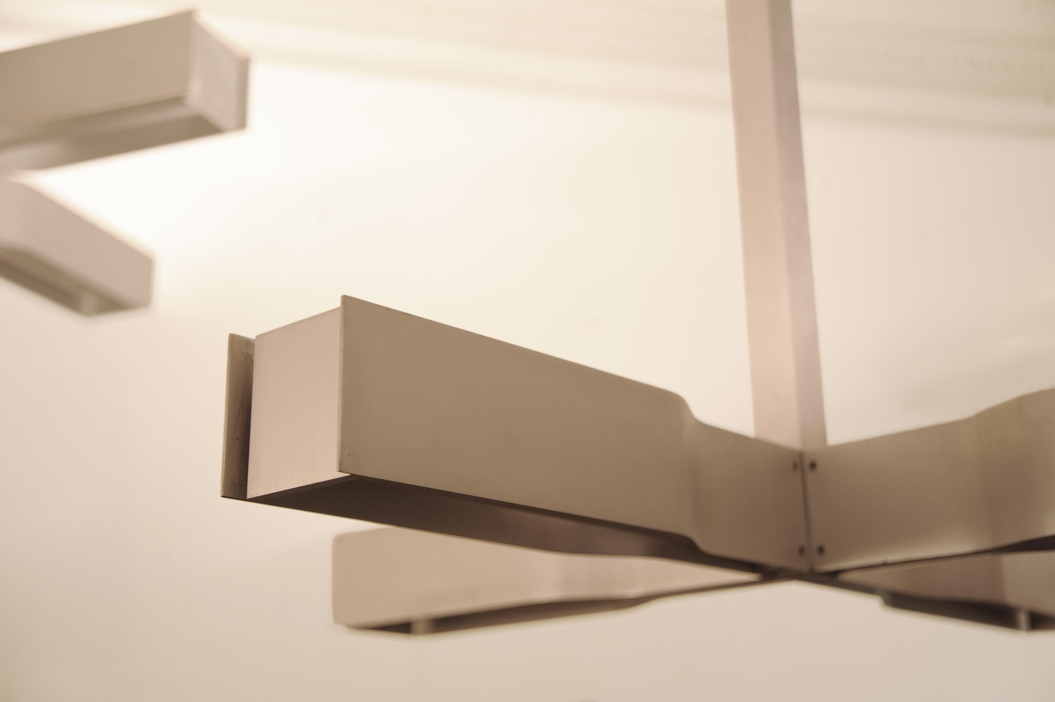 Pair of natural tone anodized aluminum chandeliers, 1970. by César Putzeys For Sale 1
