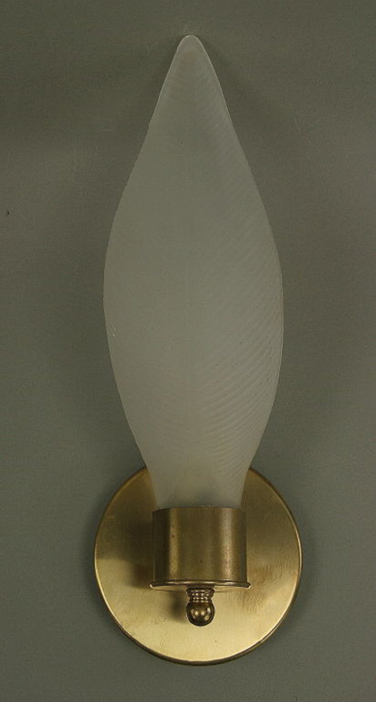 1-4065 pair of Murano glass frosted glass leaf set in a brass cylinder.
Takes one 60 watt candelabra bulb.
 