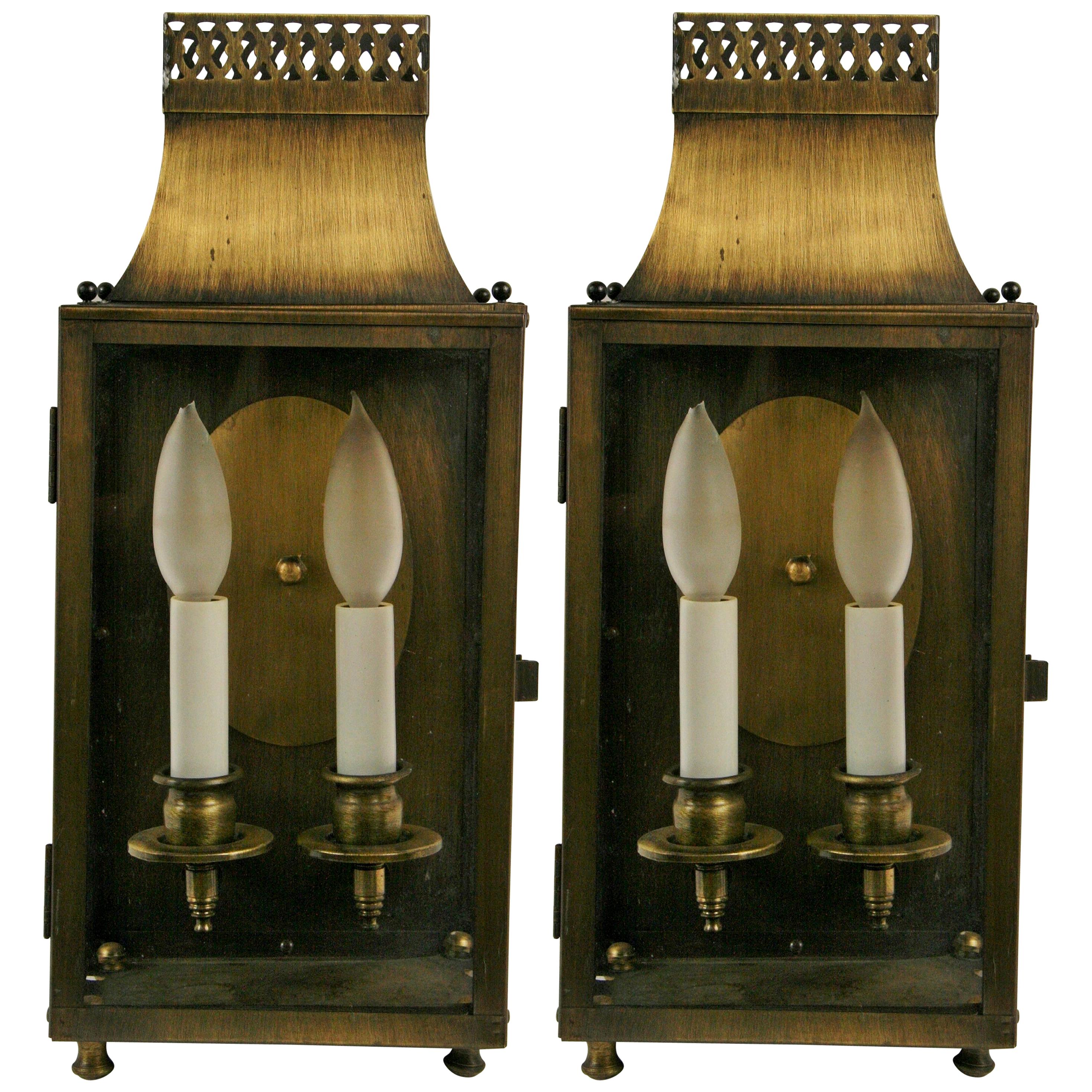 #2-1810a, a pair of patined brass-clear glass panels pagoda shaped wall sconces. Two internal light.
Candelabra base 60 W bulb.