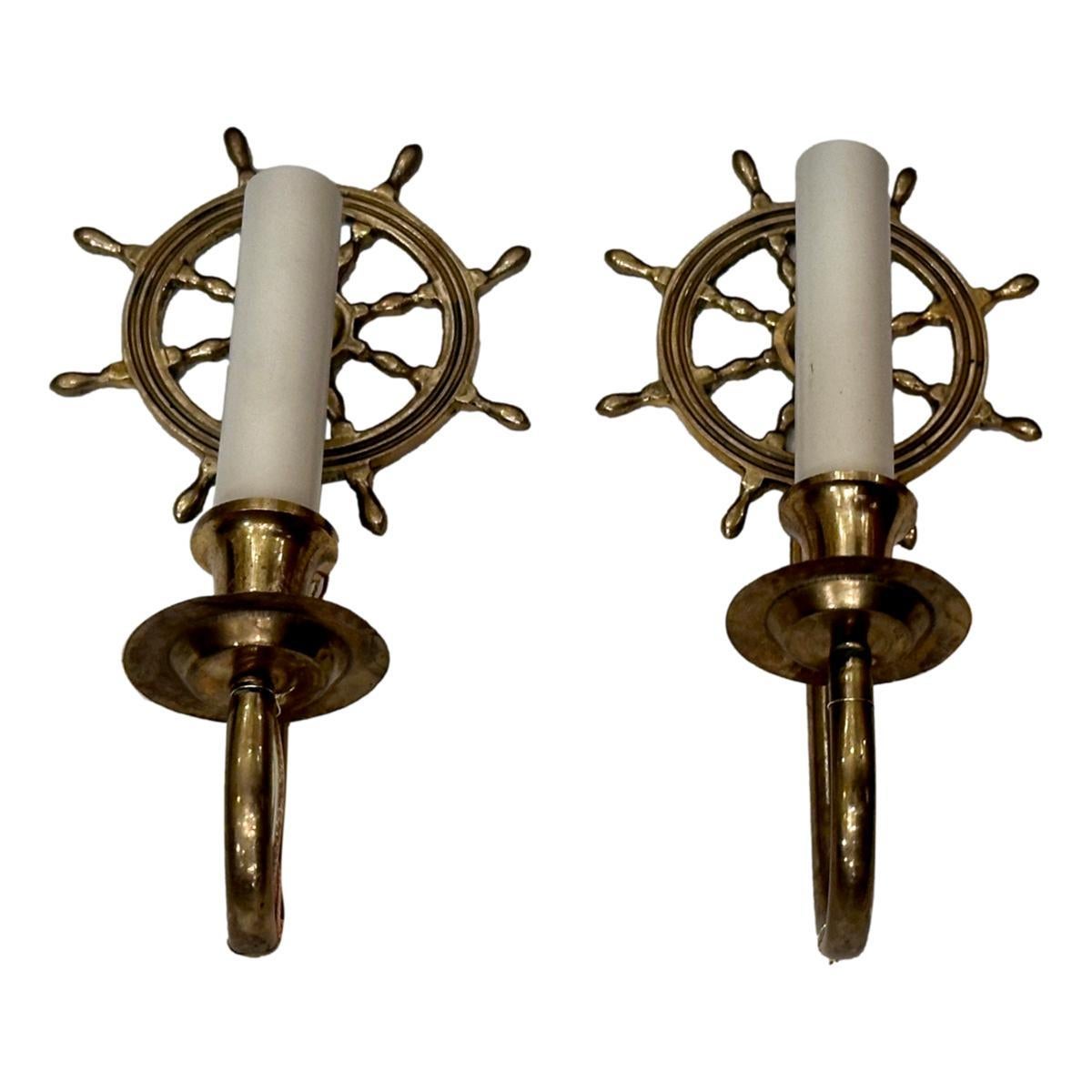 Pair of circa 1940's English ship wheel sconces with original patina.

Measurements:
Height: 9.5