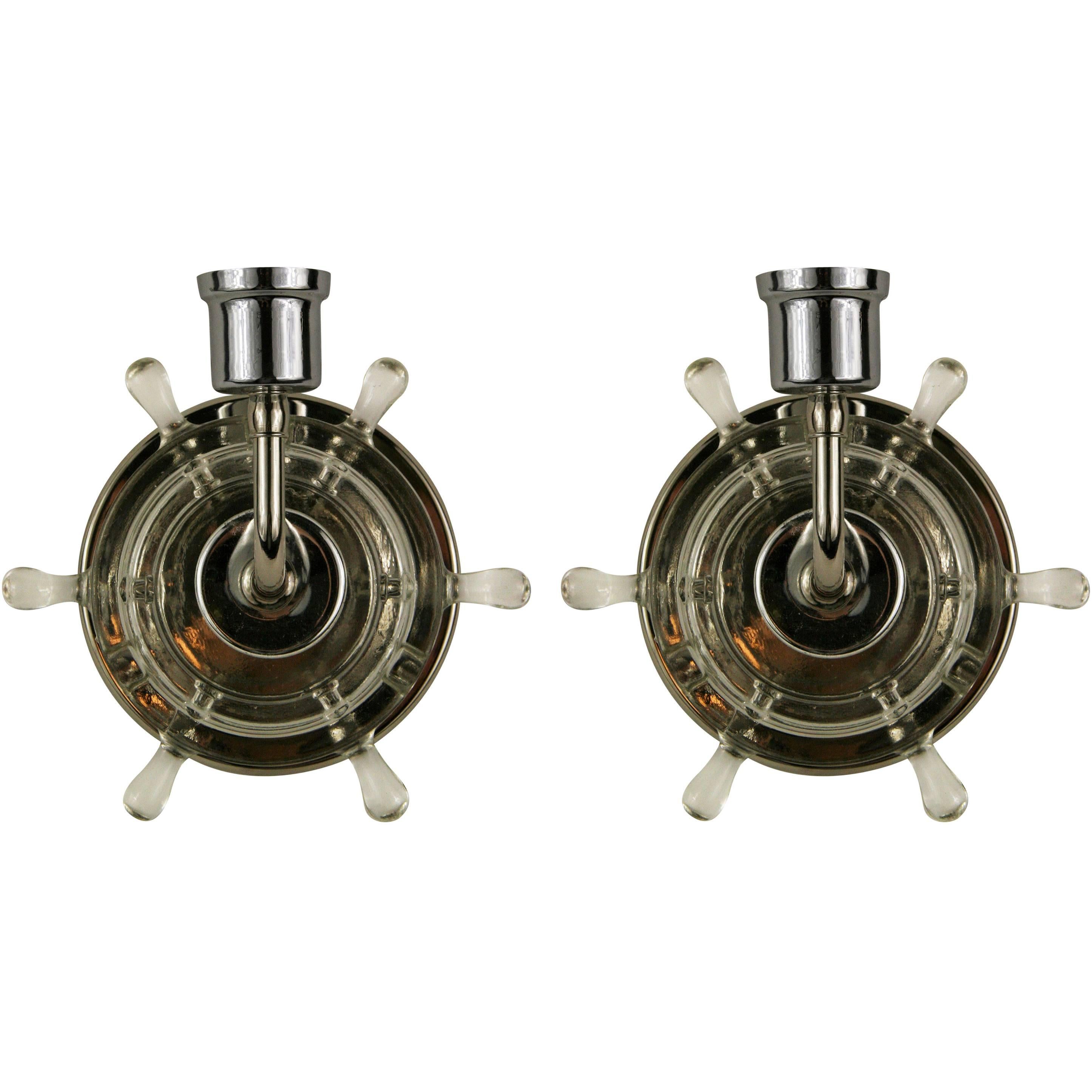 #2-1801b. A pair of nautical glass ships wheel sconces with nickel hardware. Takes one 60 W candelabra base bulb.
  