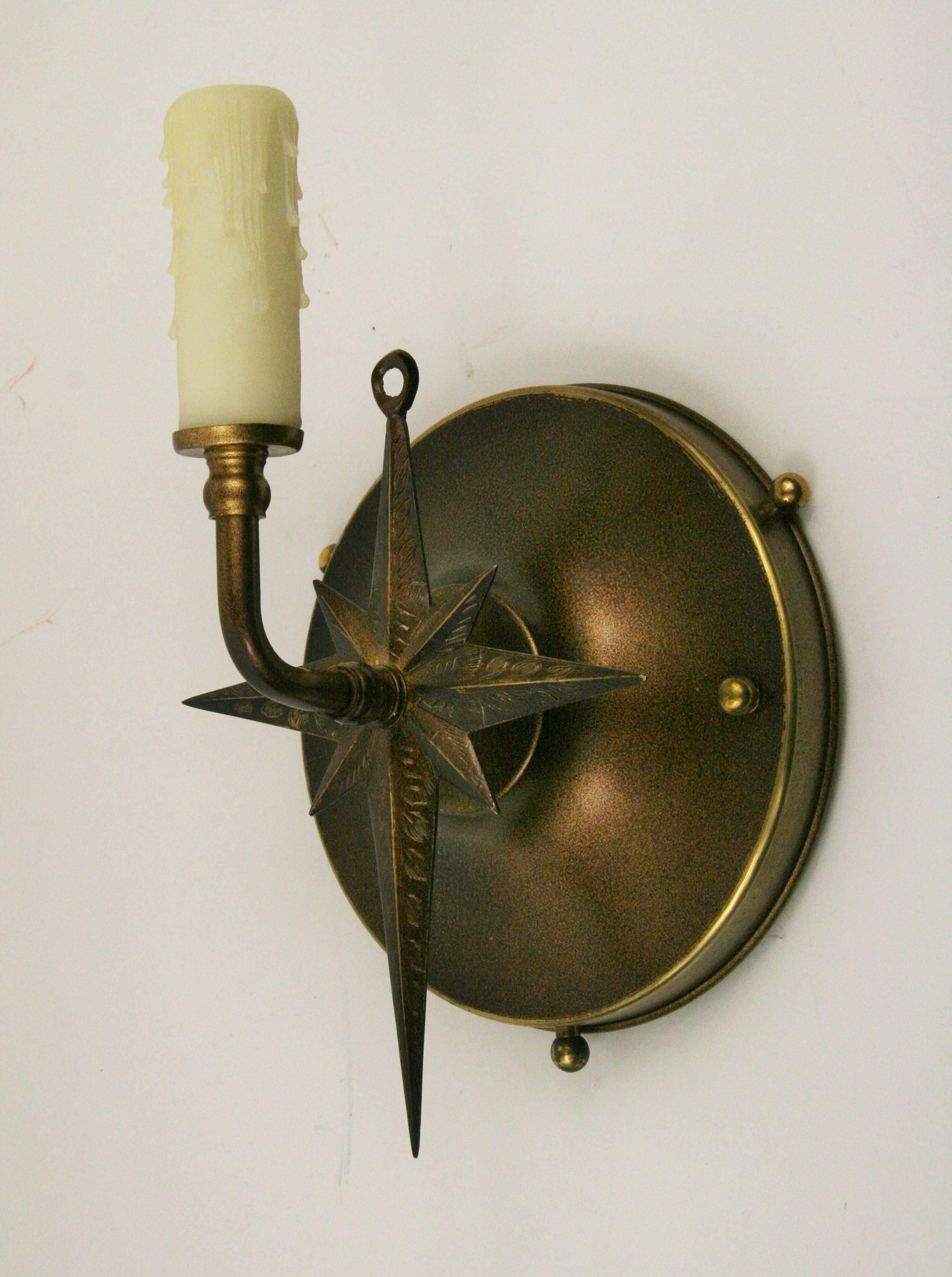 1-4033a pair of nautical brass starburst sconces.
Take one 60 watt candelabra bulb.