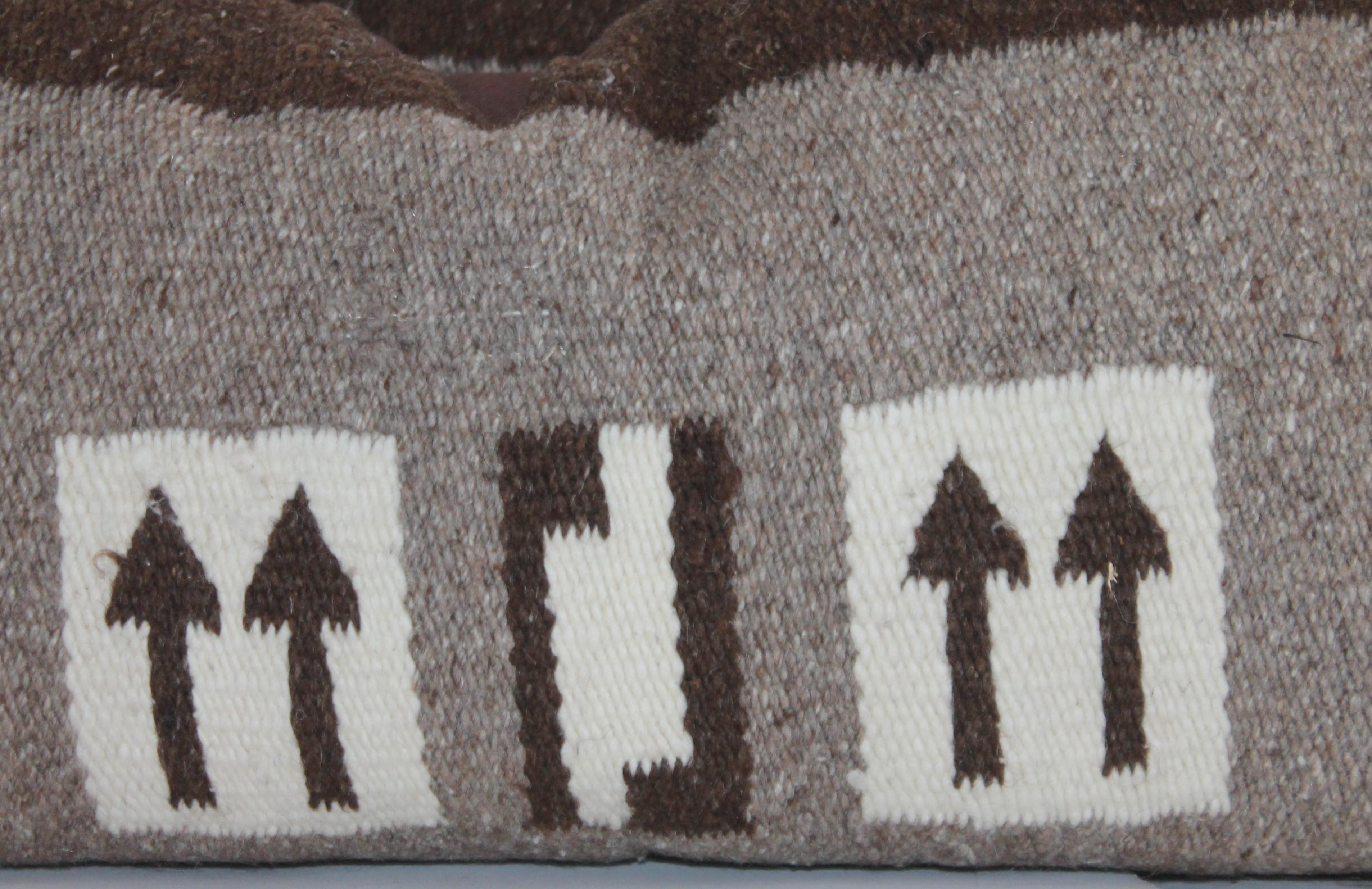 This pair of folky arrow Navajo Indian weaving pillows are in good condition and have brown cotton linen backing. The inserts are down and feather fill.