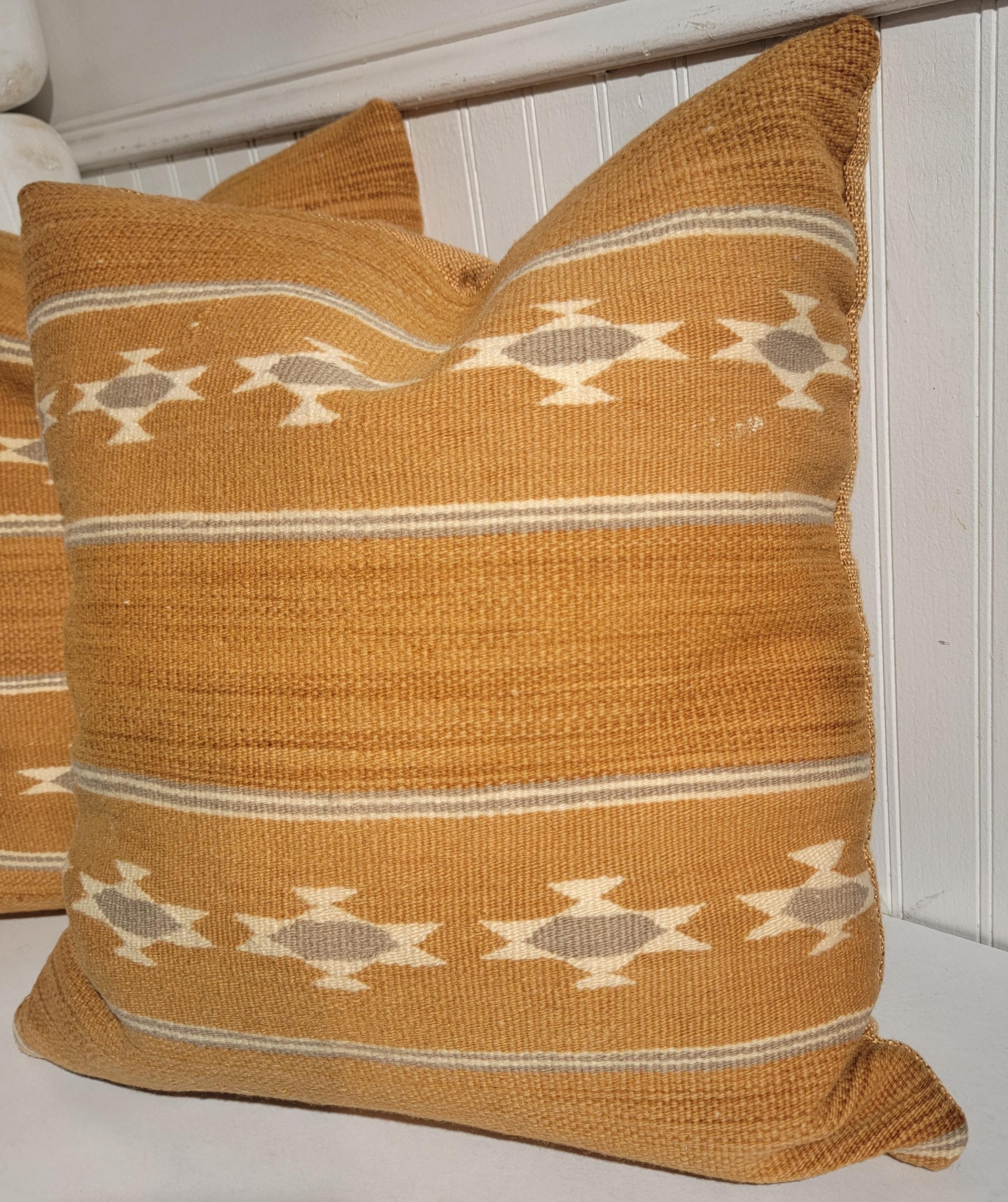 Pair of Navajo Chinle pillows with small row of Eye dazzlers in a horizontal pattern. Beautiful colors with a matching linen backing. 