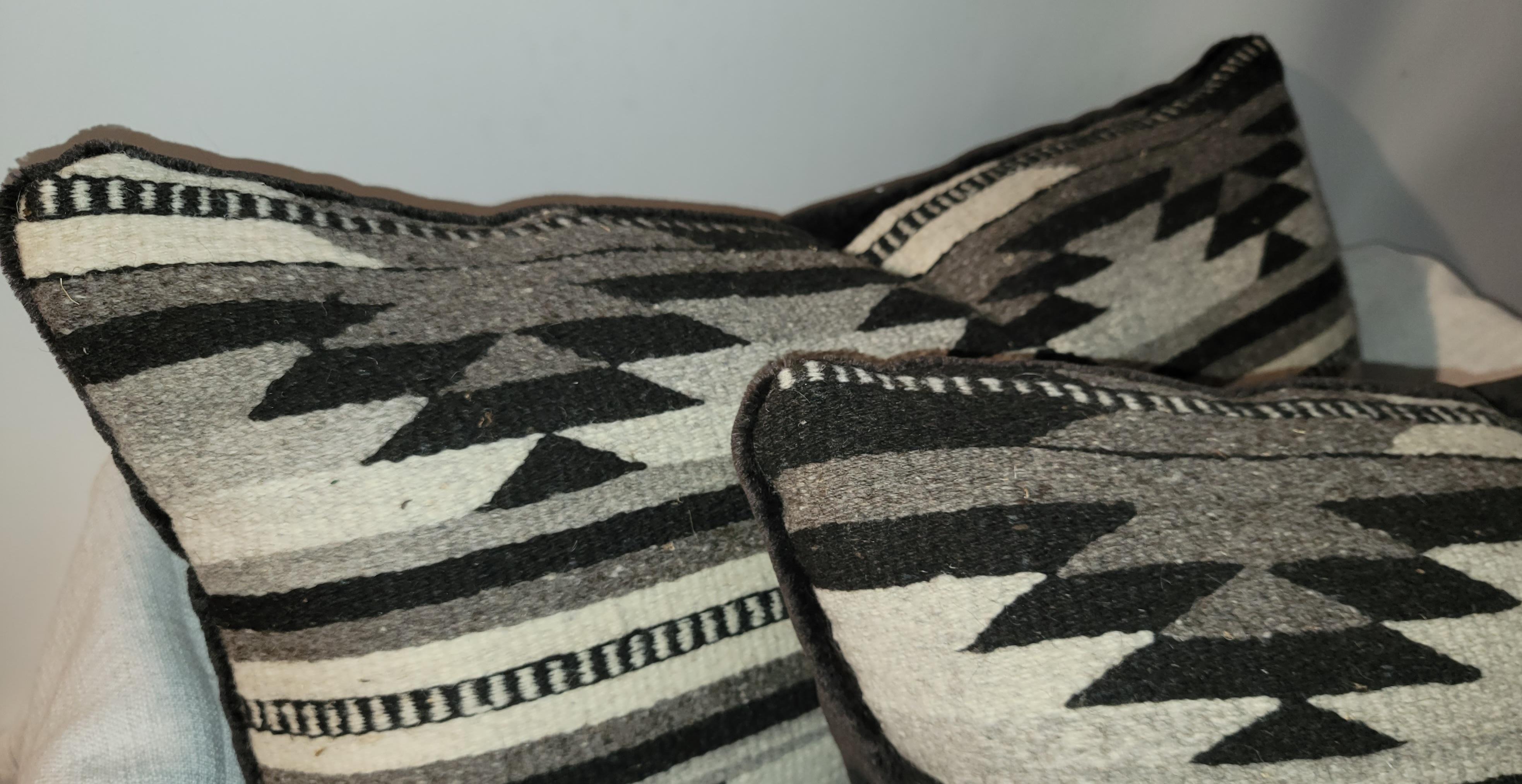 Pair of beautiful Navajo Indian weaving bolster pillows. Feather and down inserts. Zippered casing.