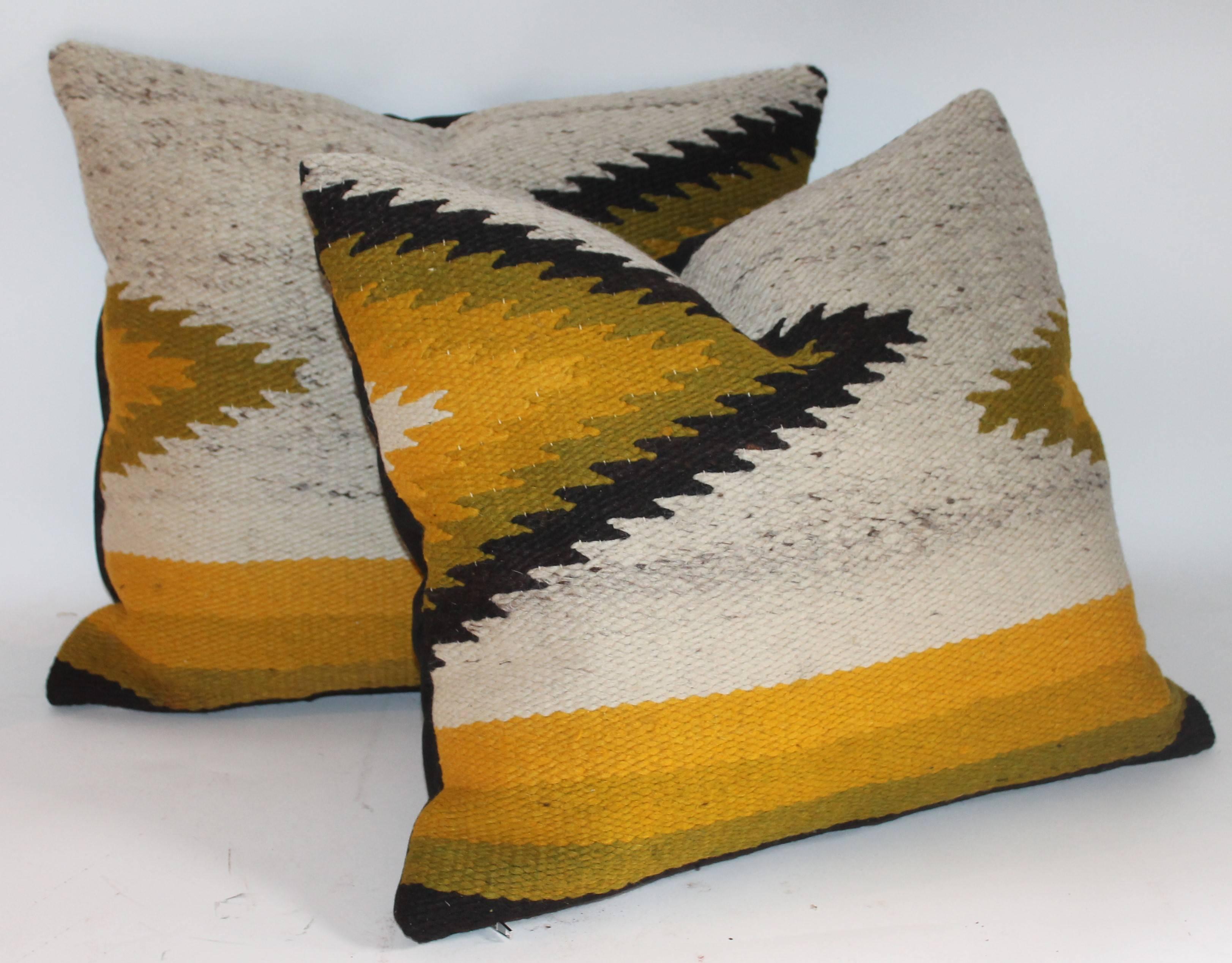 These very detailed Indian weaving pillows are geometric and very punchy. The weaving's are in fine condition. The backings are in grey cotton linen.