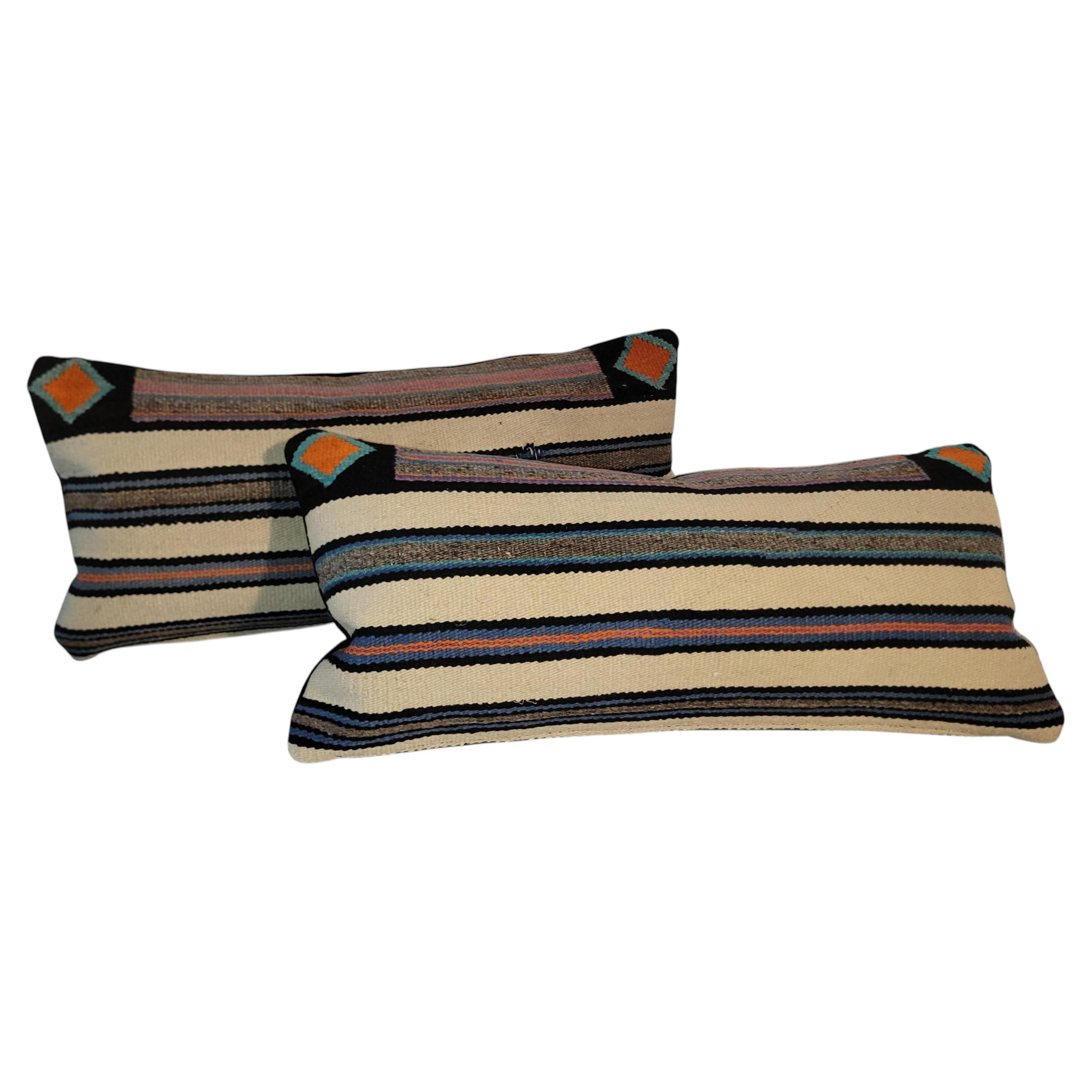 Pair of Navajo Striped Kidney Pillows.