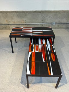 Pair of navette coffee table by Roger Capron