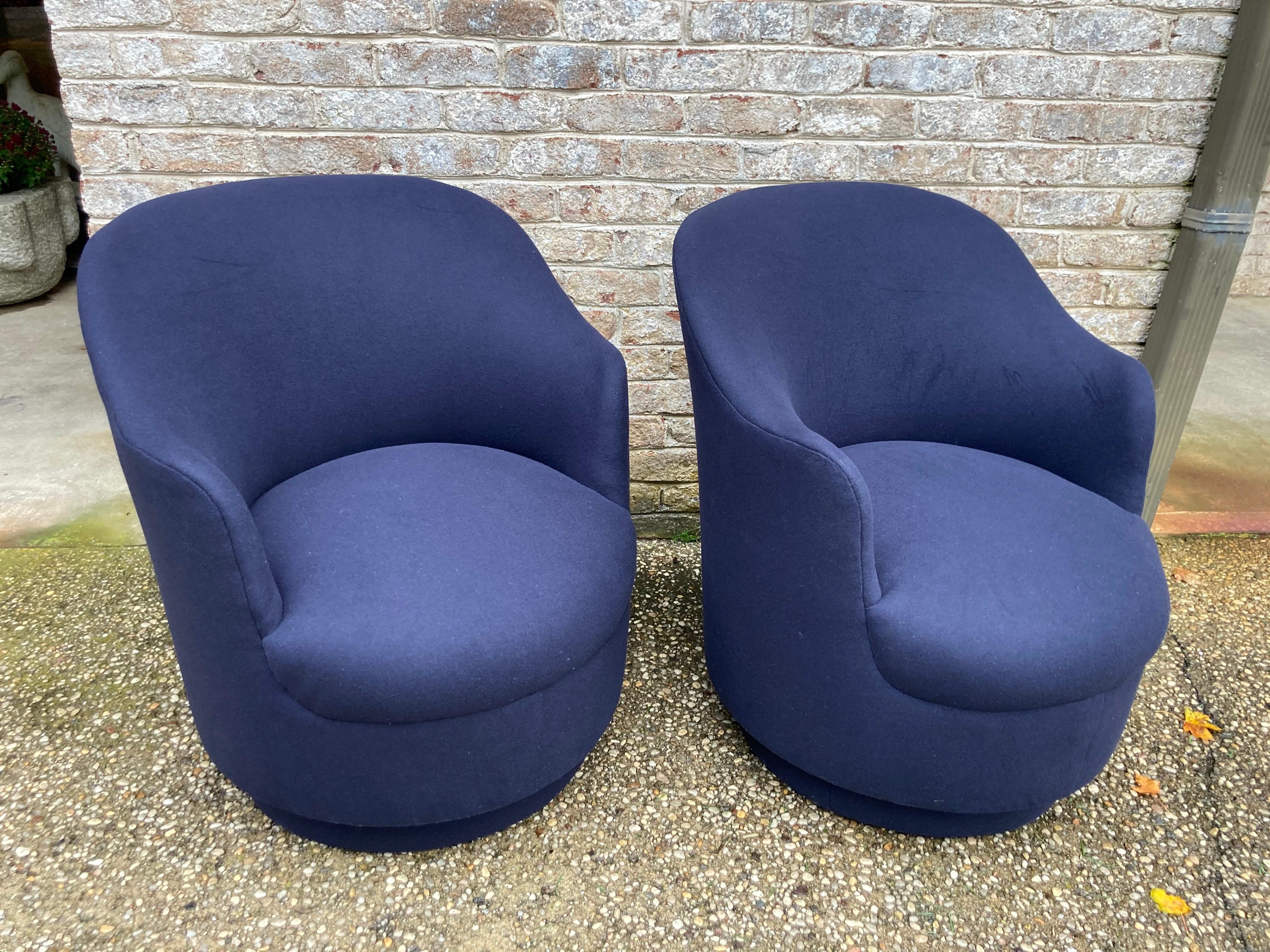 Great pair of navy wool/cashmere swivel base armchairs.... newly reupholstered.... attributed to Milo Baughman.... they are a true navy blue even though the photos look lighter...