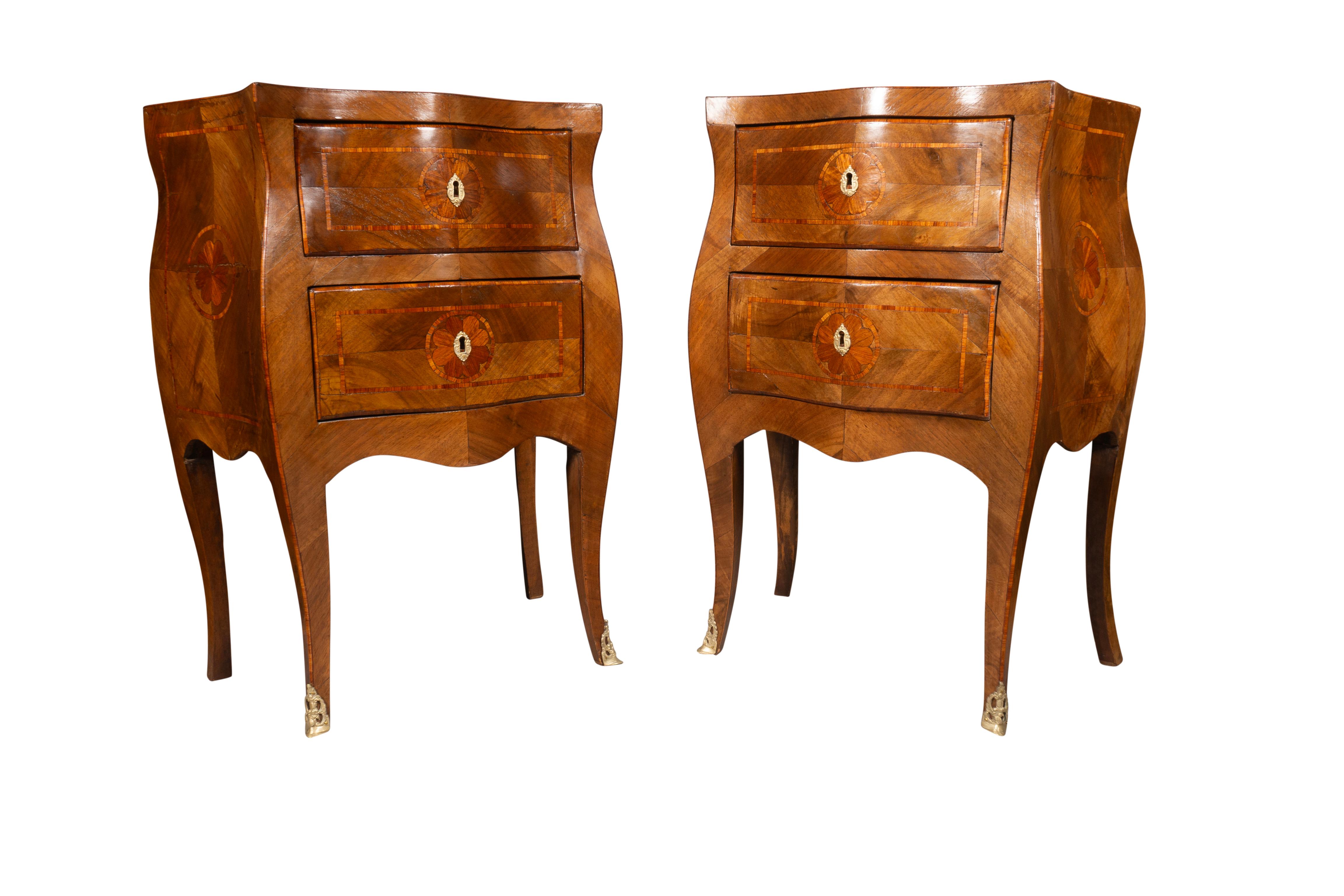 Serpentine top over bombe form two drawers and sides , cabriole legs. Bronze feet.