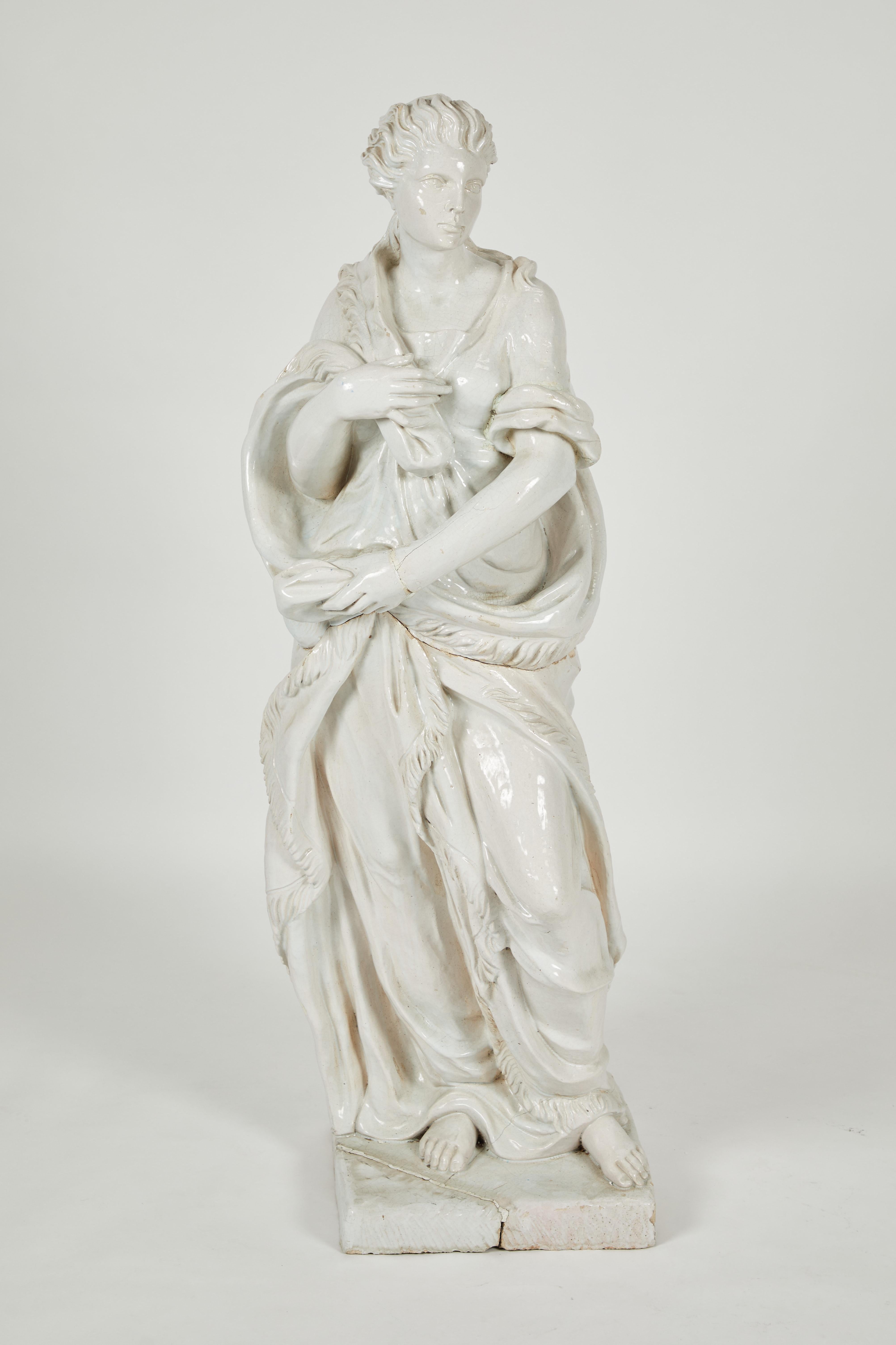 Pair of Near Life-Sized Continental Glazed Earthenware Statues In Fair Condition For Sale In Los Angeles, CA