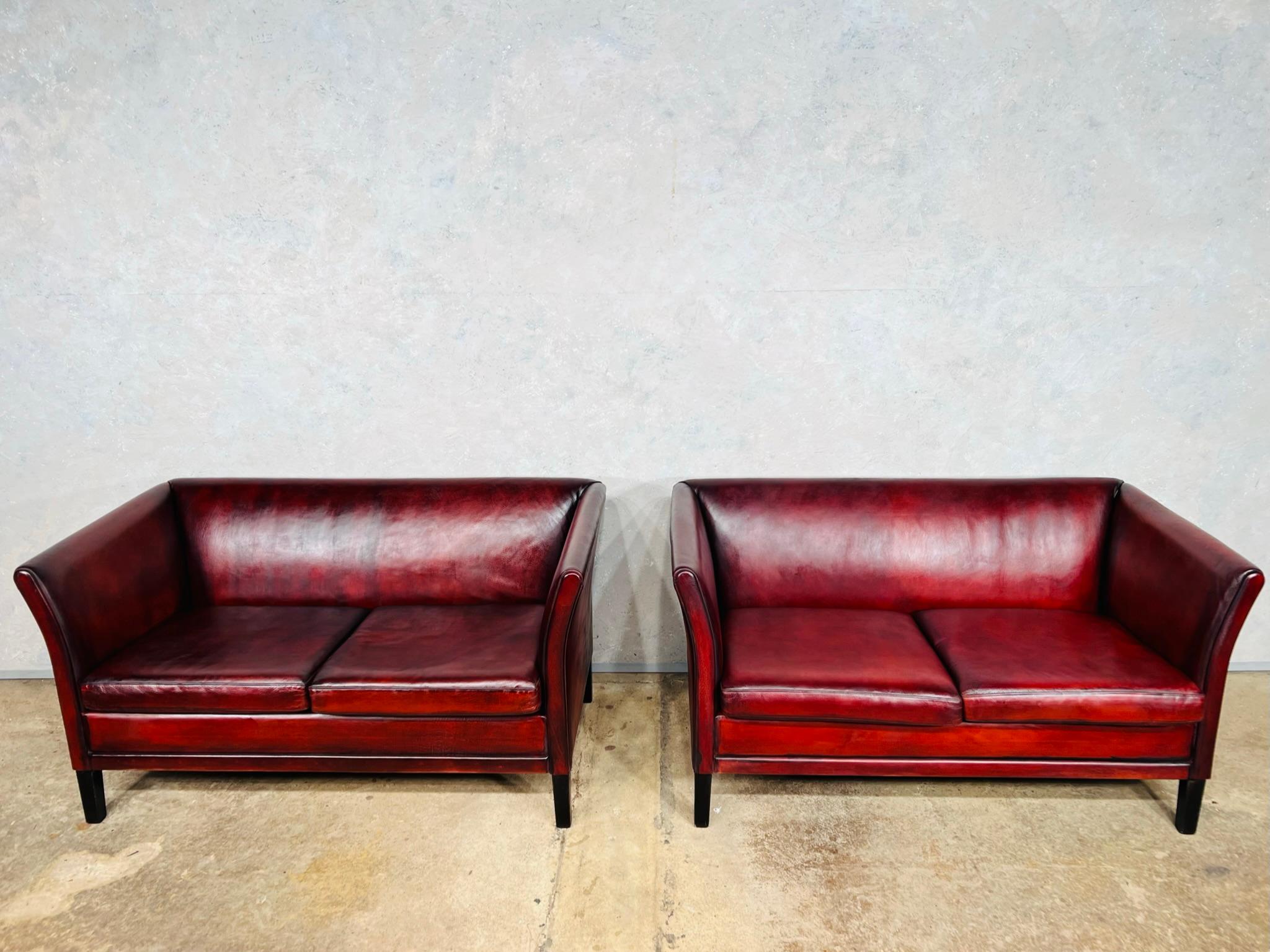 Pair of neat vintage danish 1970s patinated chestnut red 2 seat leather sofas
Stunning hand dyed patinated deep chestnut red colour with great patina and finish.

Viewings welcome at our showroom in Lewes, East Sussex.

Delivery to mainland UK
