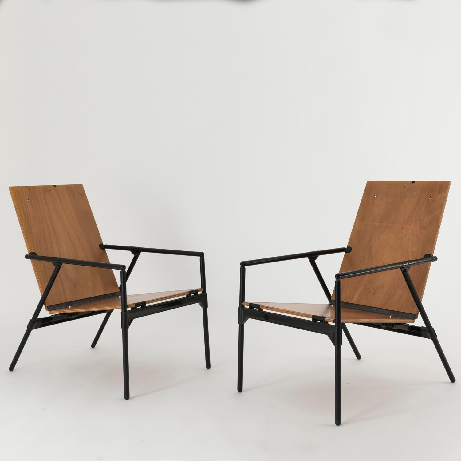 Pair of Nena armchairs designed by Richard Sapper in 1984, thanks to a deep study over materials and function, these armchairs are very light and easy to fold and hang.