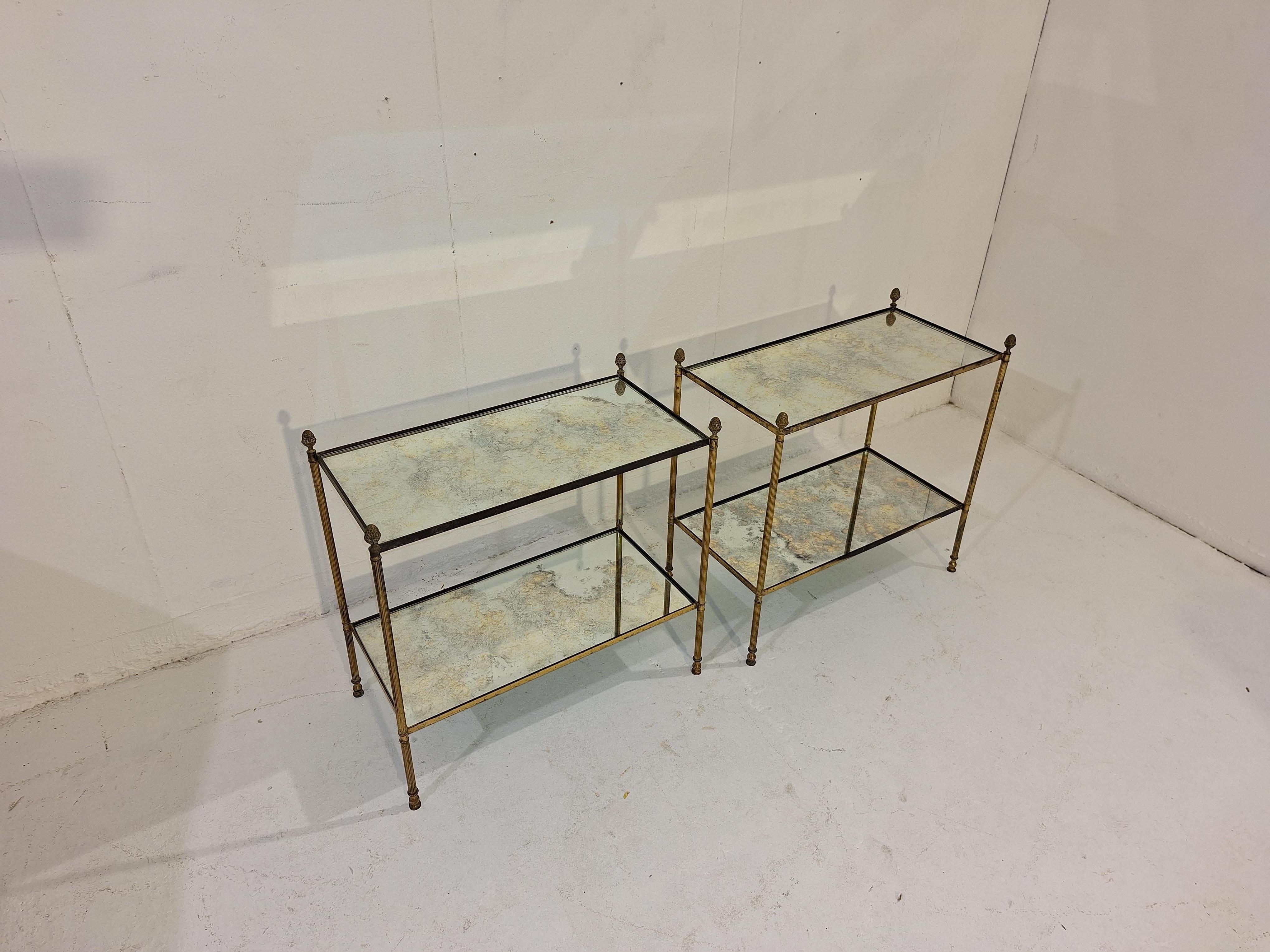 Pair of side tables in brass and oxidized mirror shelves. Attributed to Maison Jansen