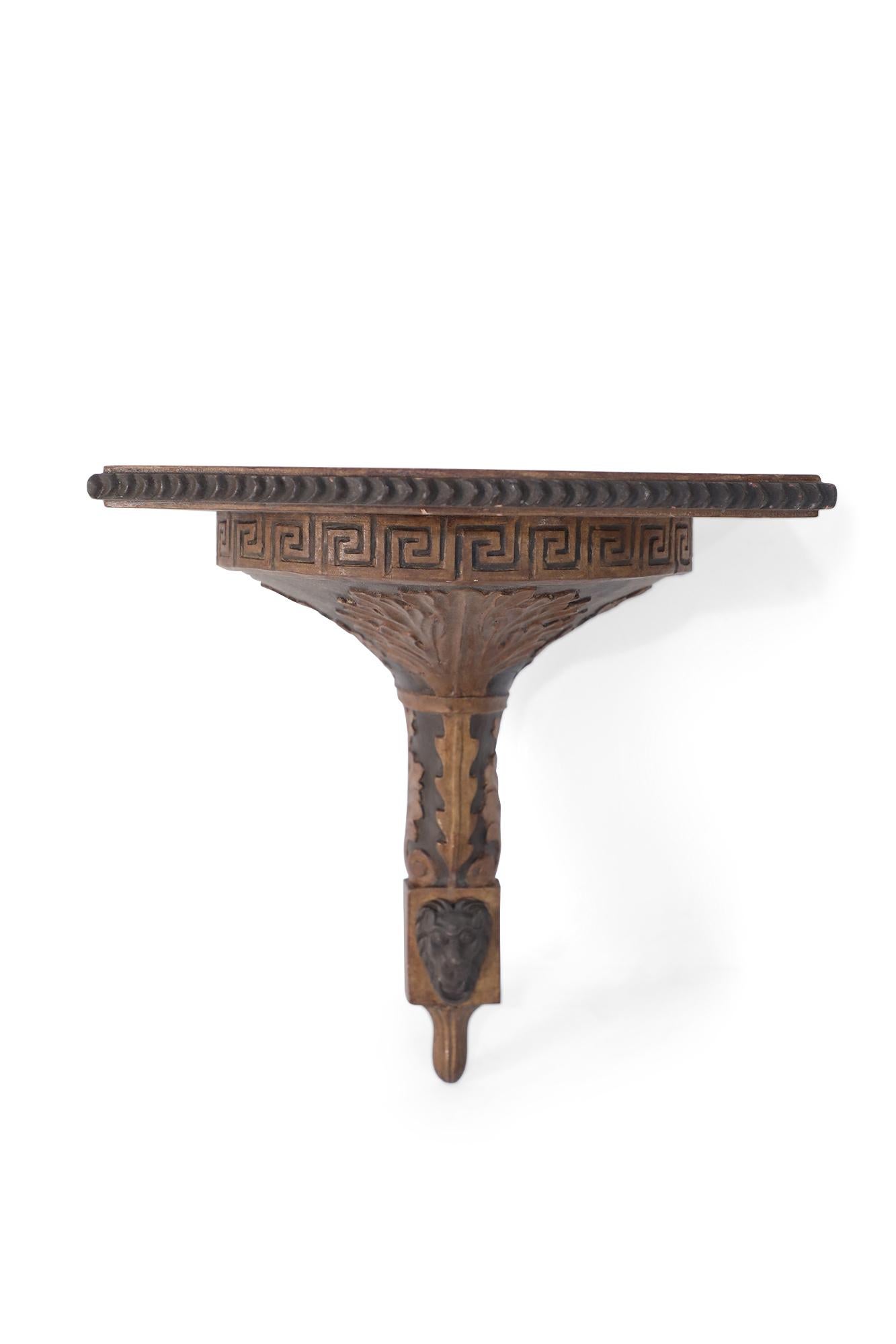 Pair of neoclassical-style carved wooden wall shelves with demilune tops, with a notch-carved lip over a carved Greek key top border and decorative acanthus leaves.