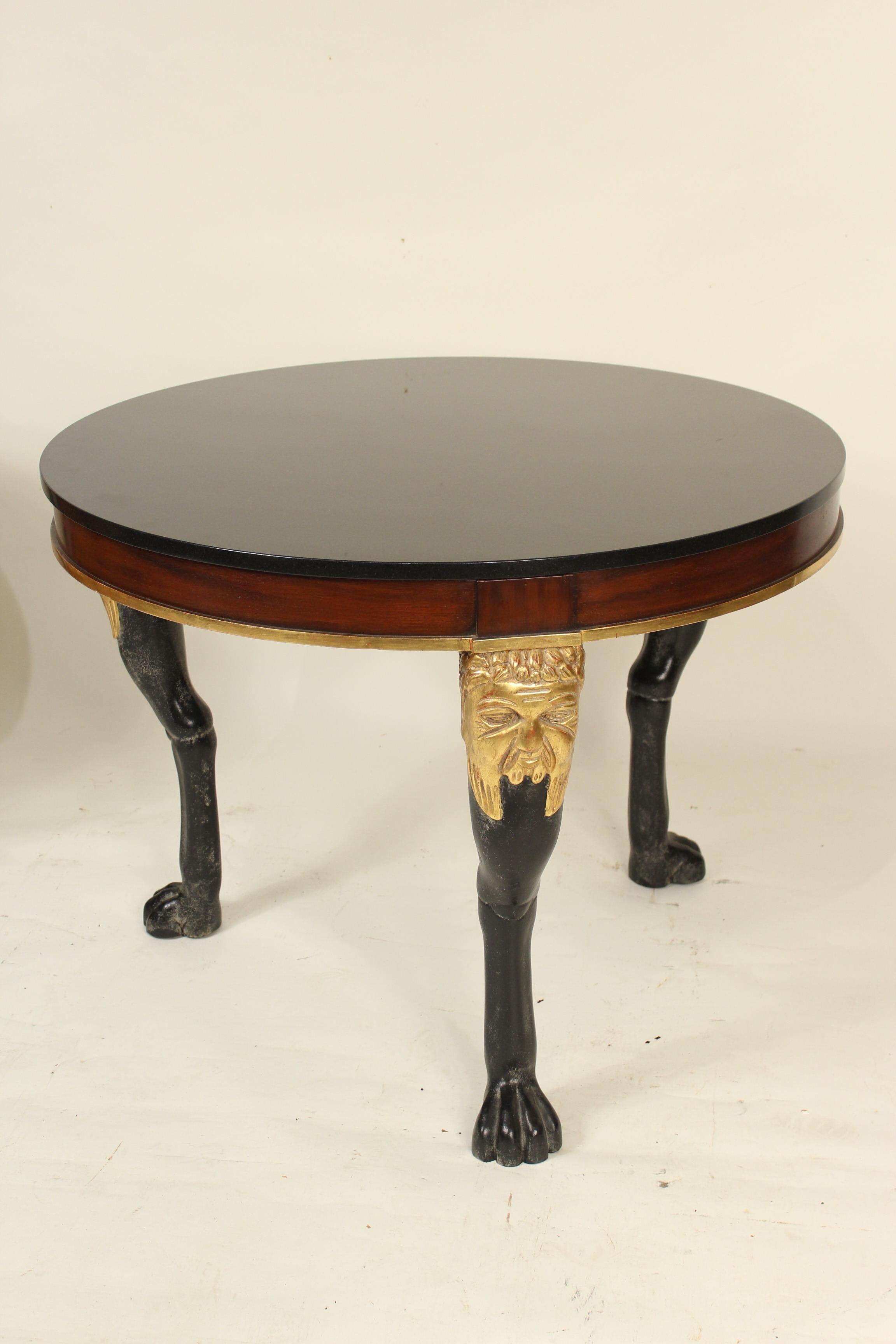 Pair of large scale neoclassical style gold leaf, mahogany and painted occasional tables with marble tops, late 20th century. Inscription on the bottom of one table indicates an association with Quatrain, in Los Angeles, either made by or used in a