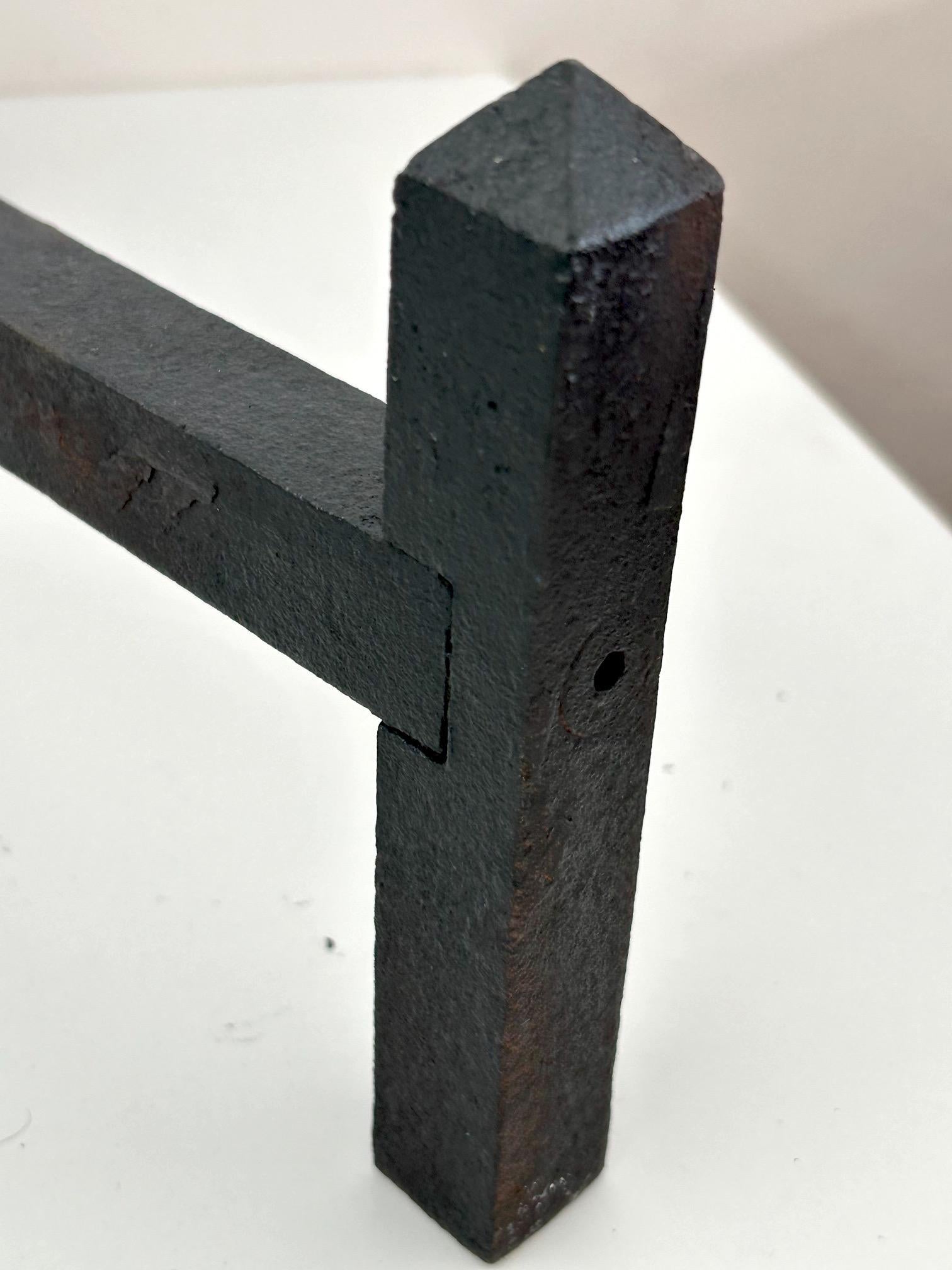 Pair of neo-classical wrought iron andirons dating from the 1950s (Eisen) im Angebot